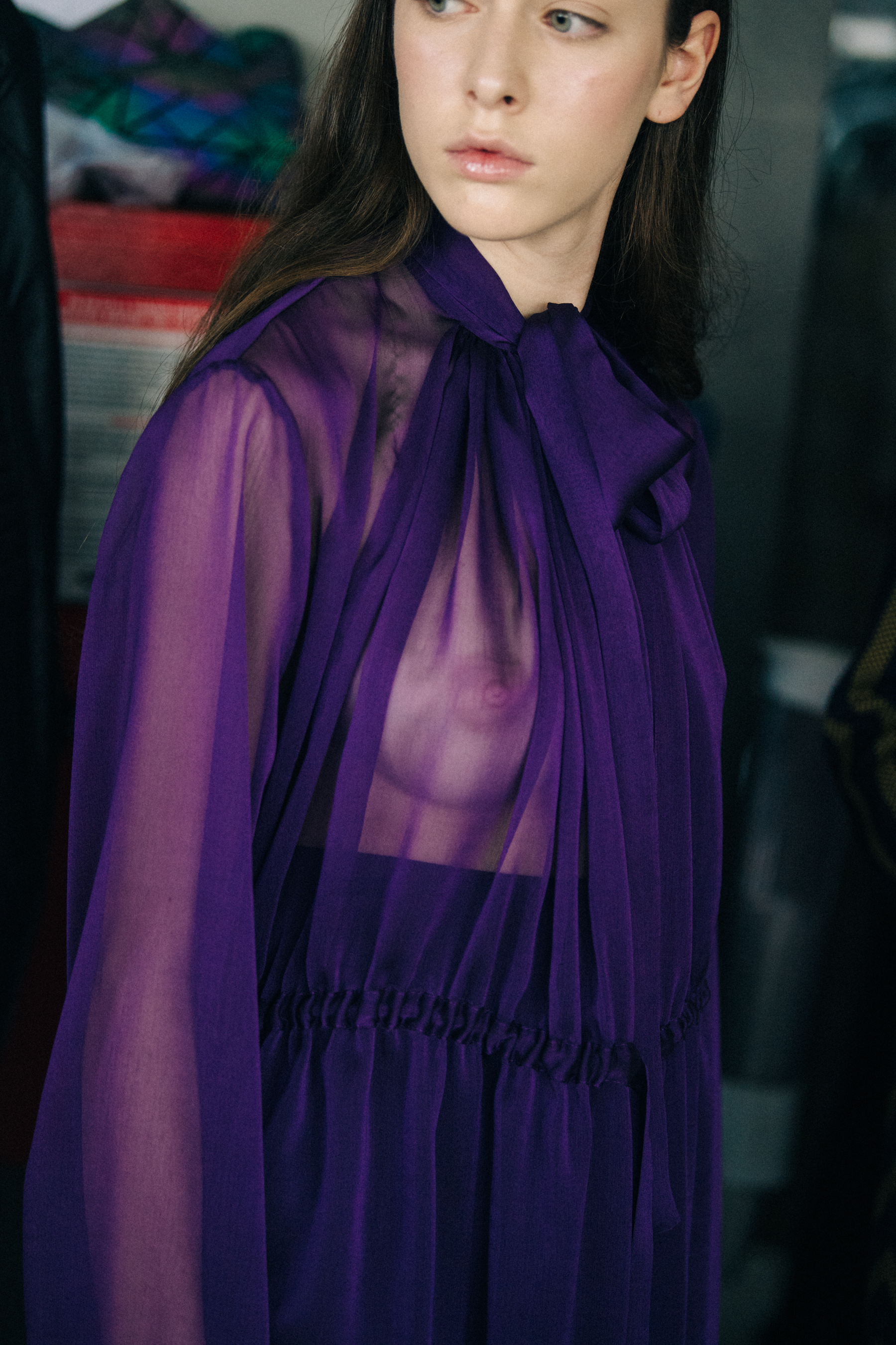 Model wearing purple top backstage