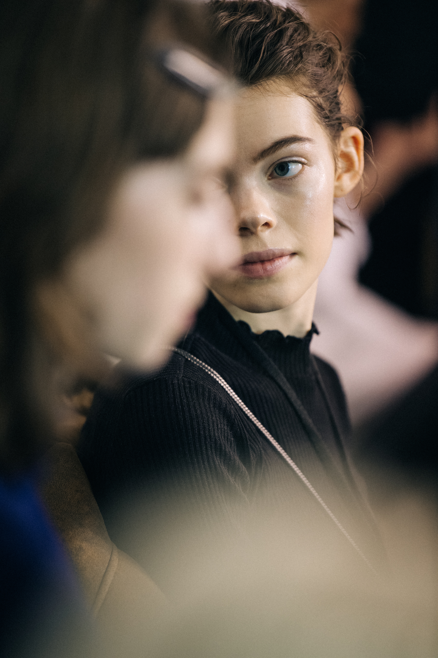 Model in hair and makeup backstage