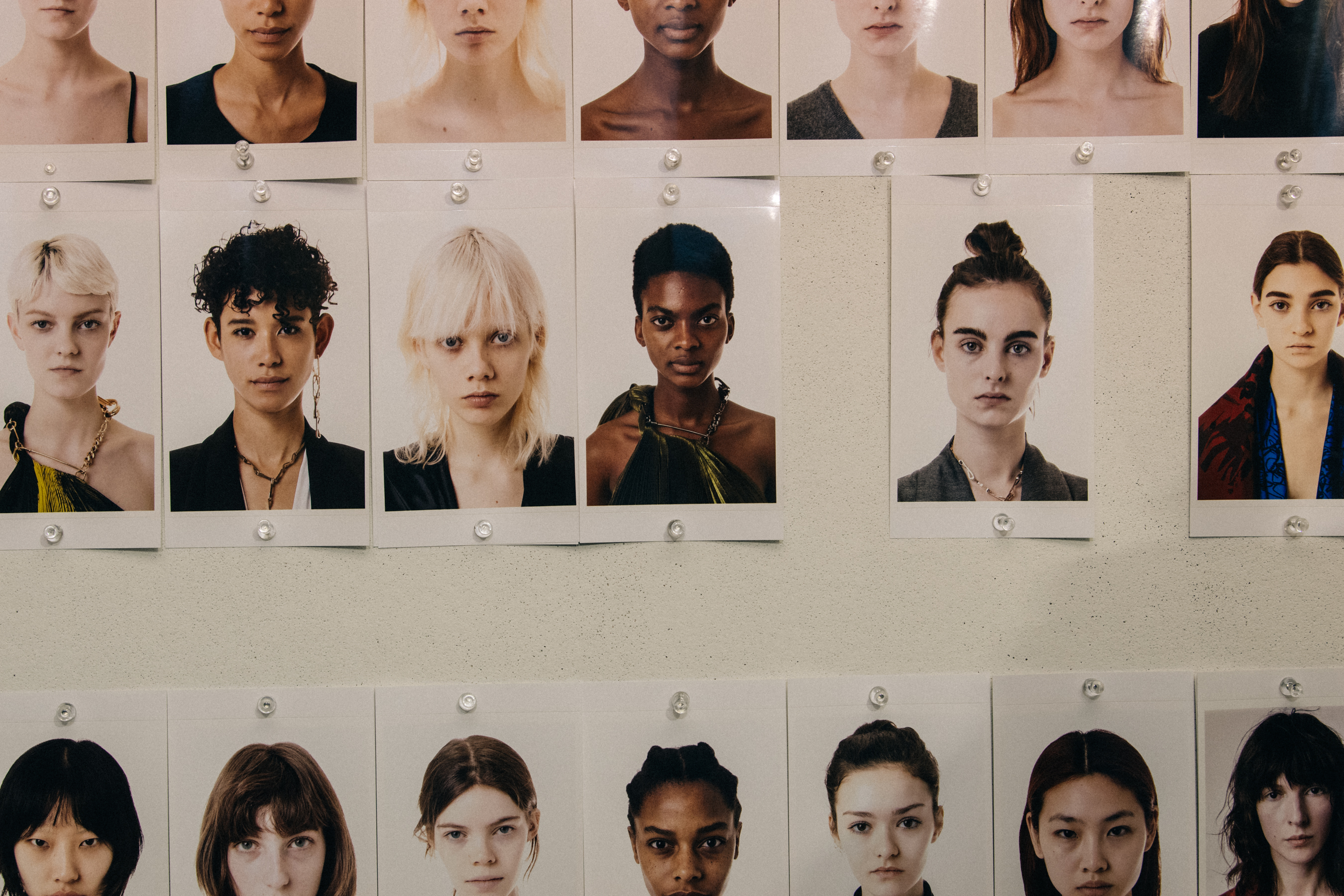 Model polaroids and outfit cards backstage