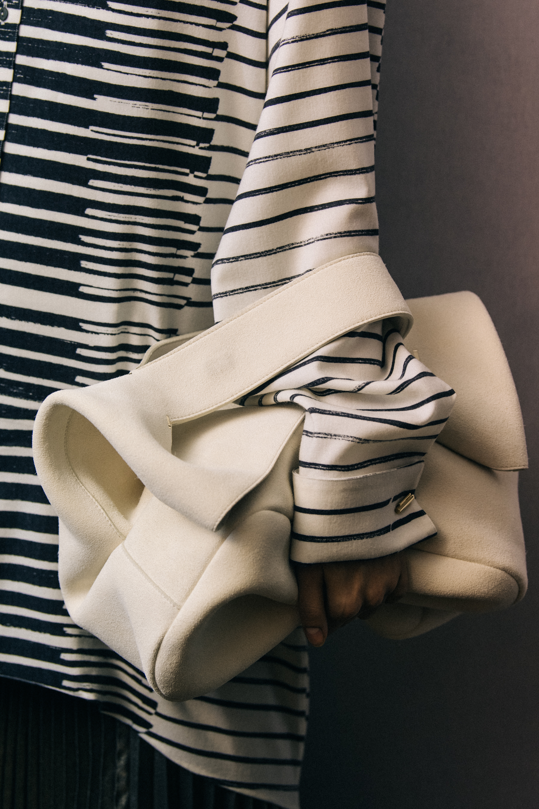 Model wearing black and white Poiret outfit