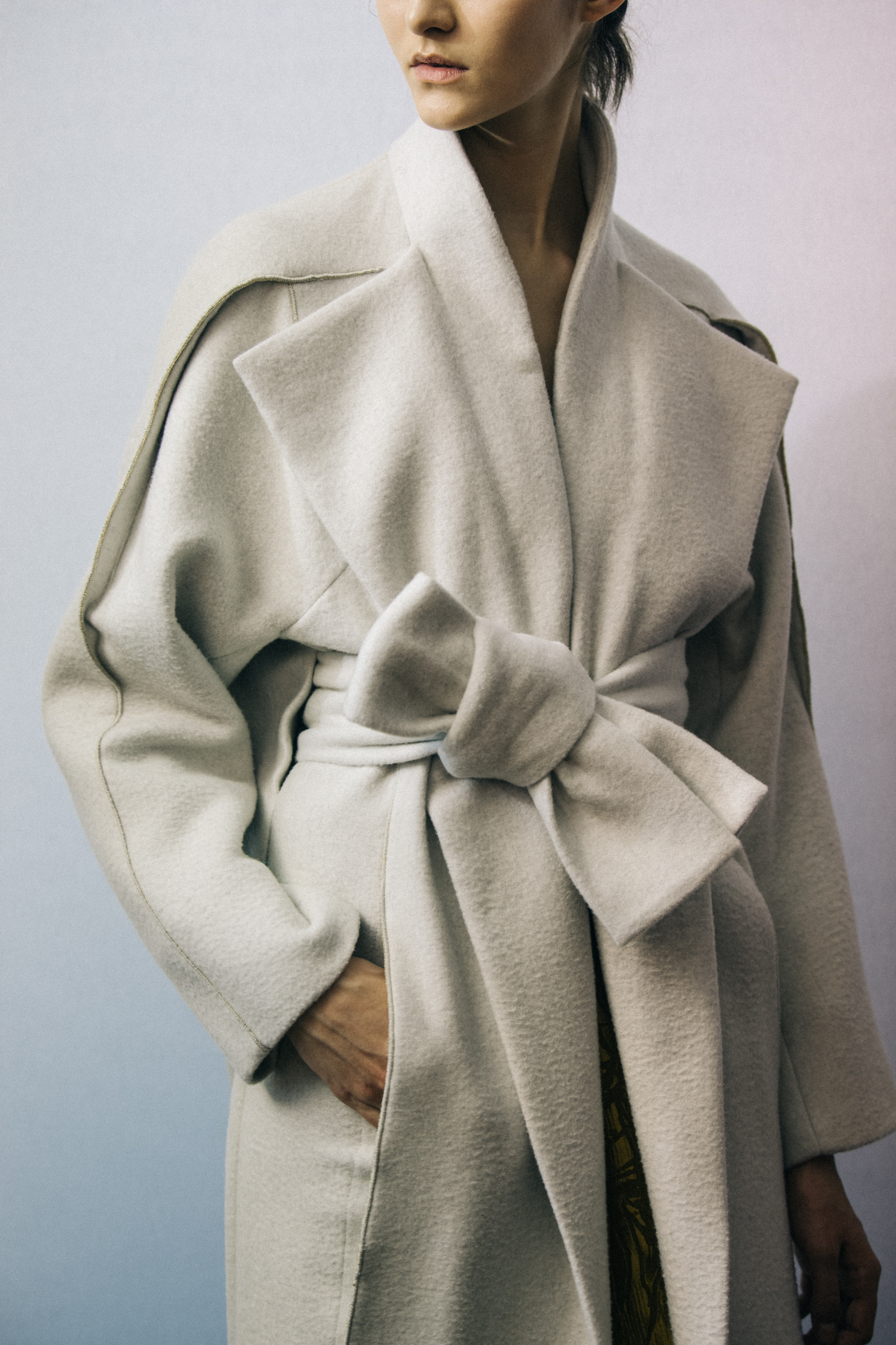 Model wearing white wool Poiret coat