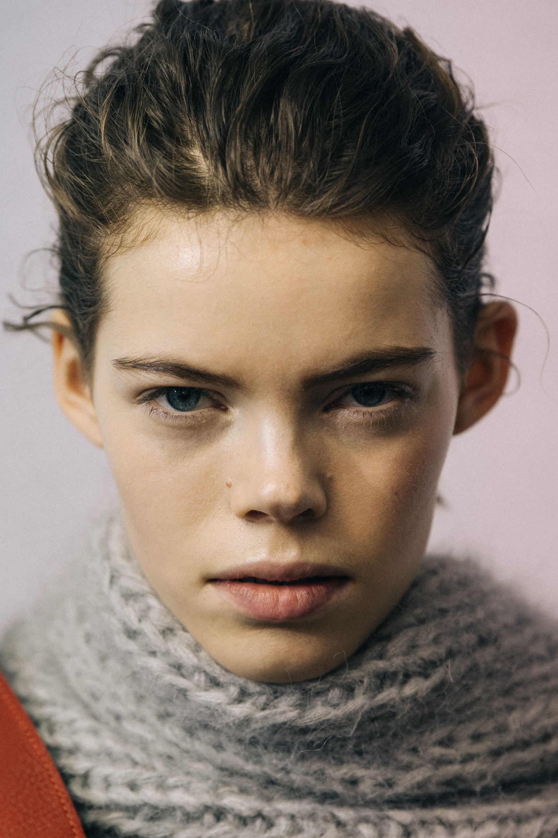 Portrait of model wearing grey scarf