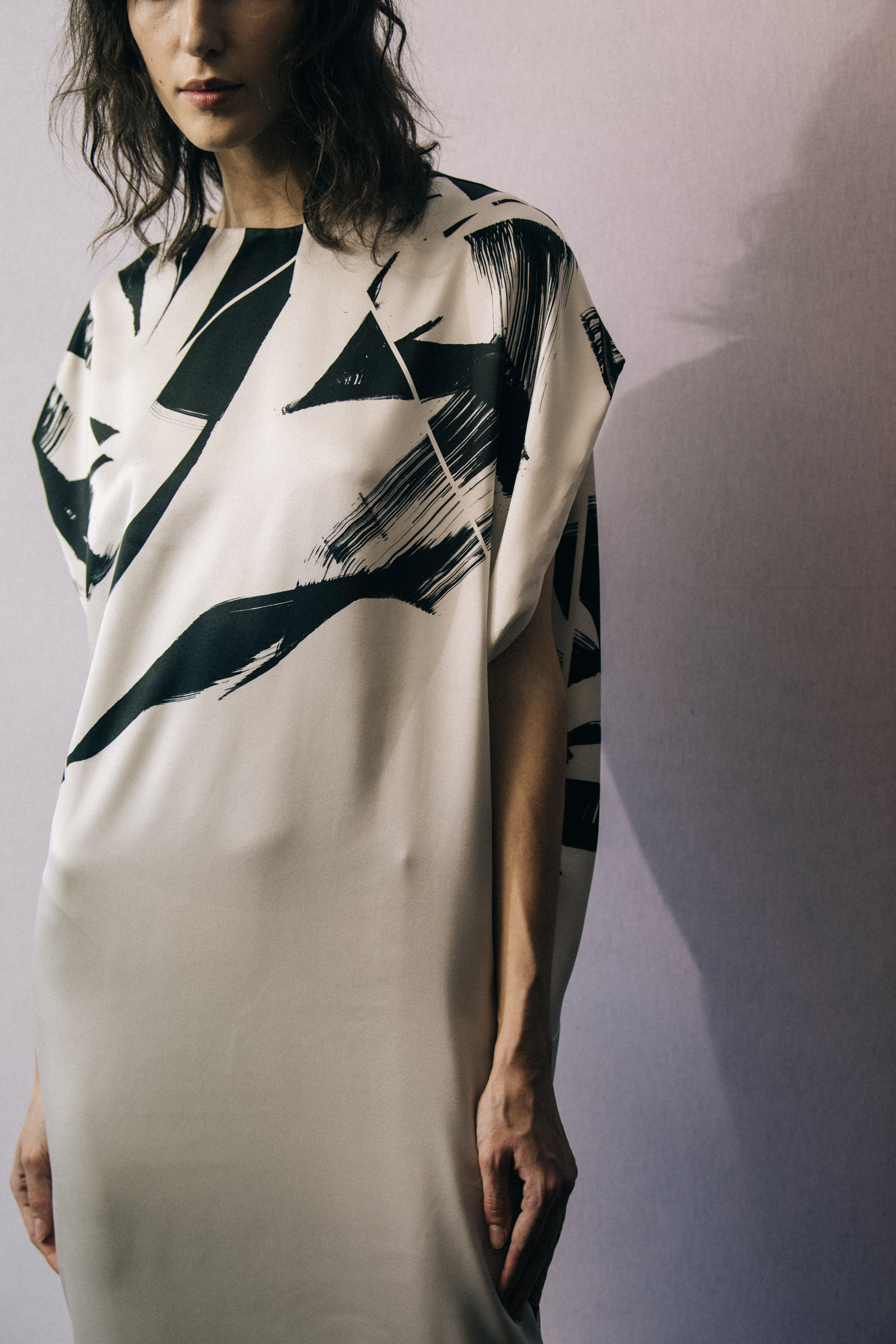 Model wearing black and white Poiret outfit