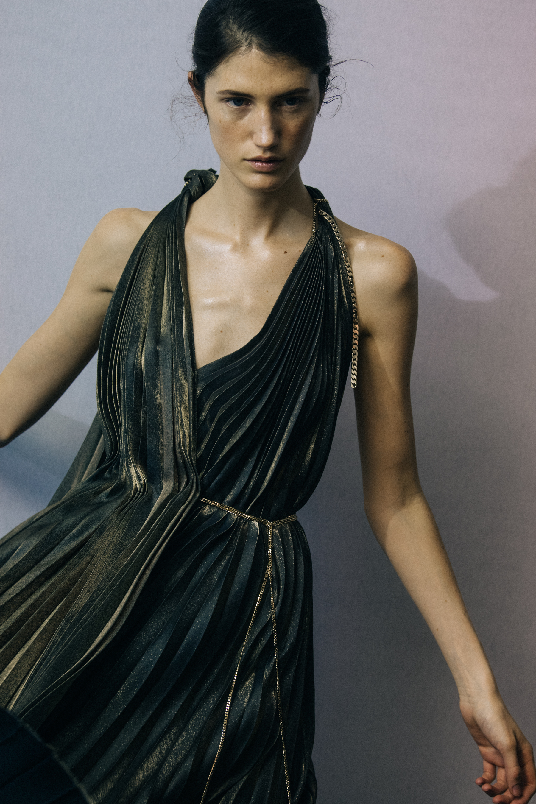 Model wearing dark gold dress at Poiret