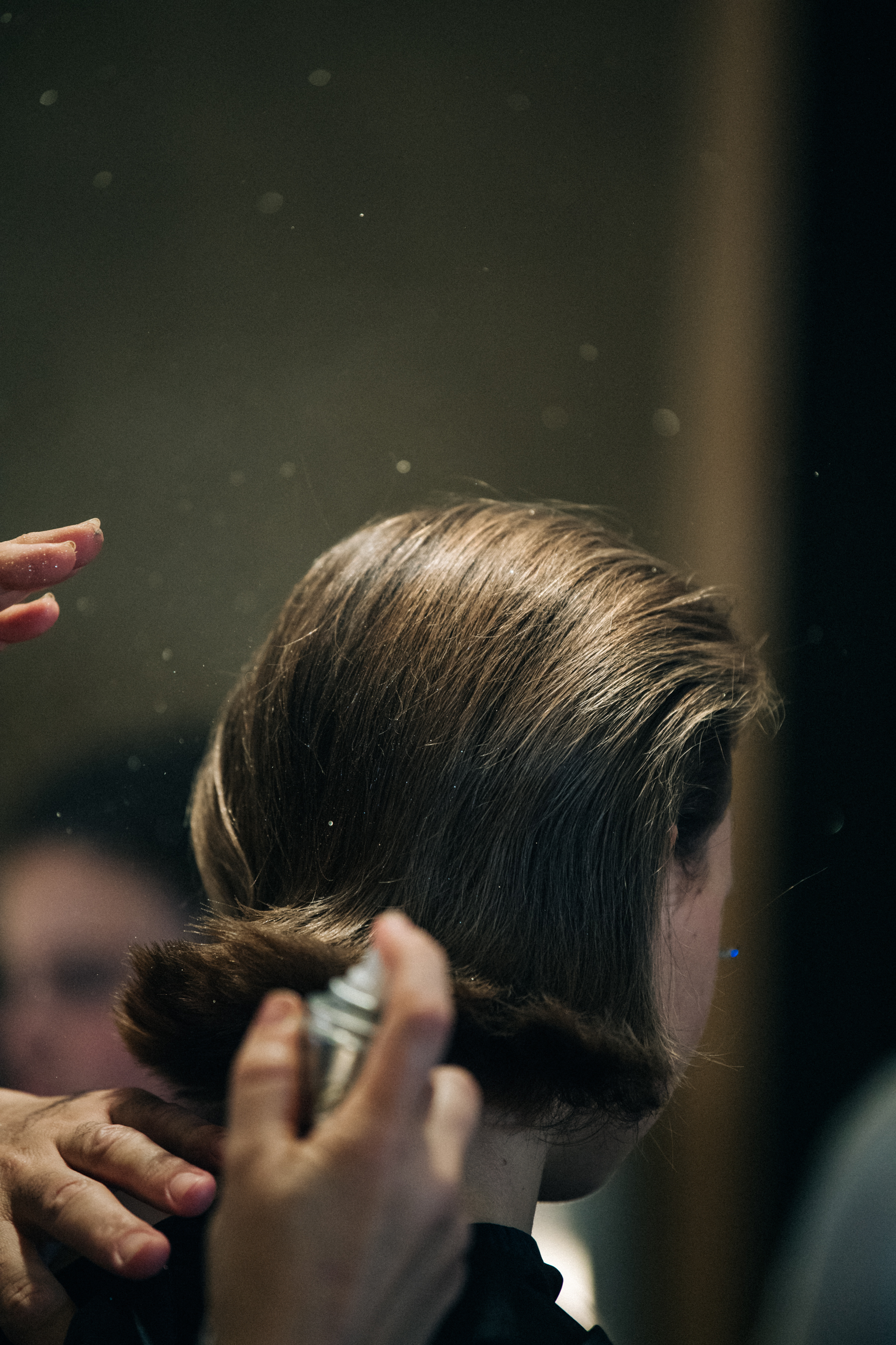 Model having makeup applied backstage