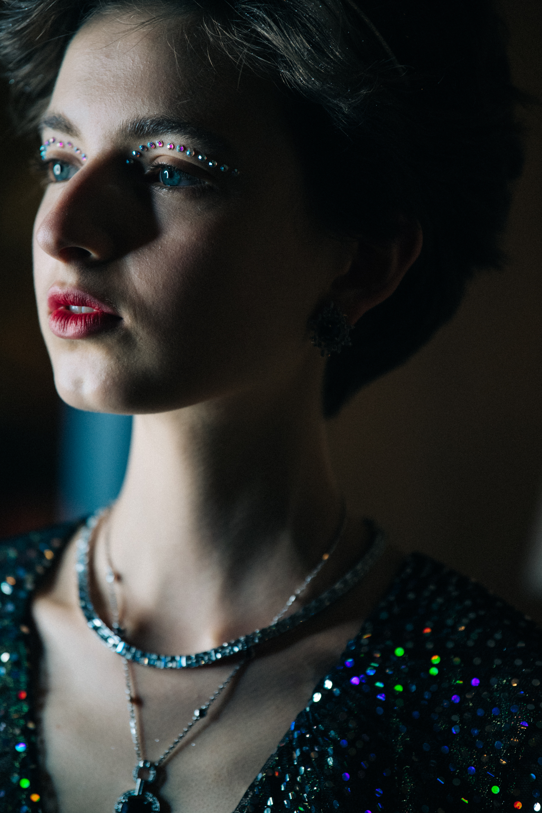 Model wearing large silver earrings