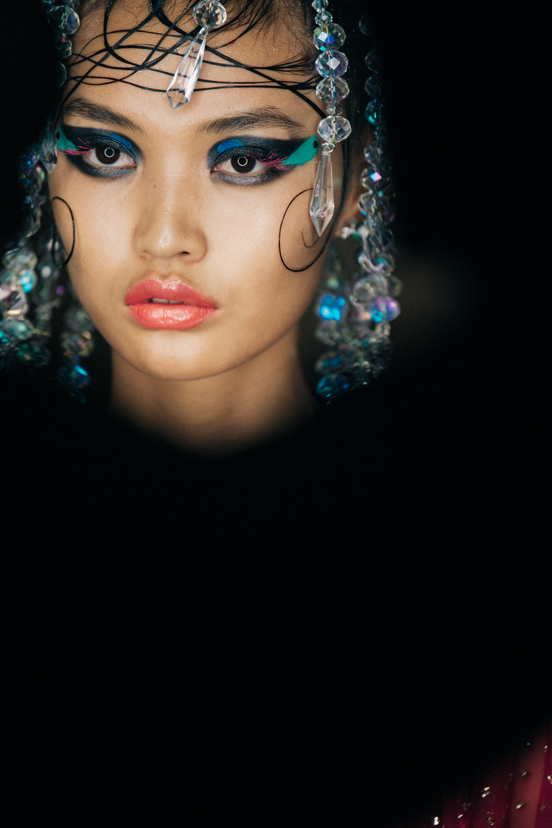 Model with slick styled hair backstage
