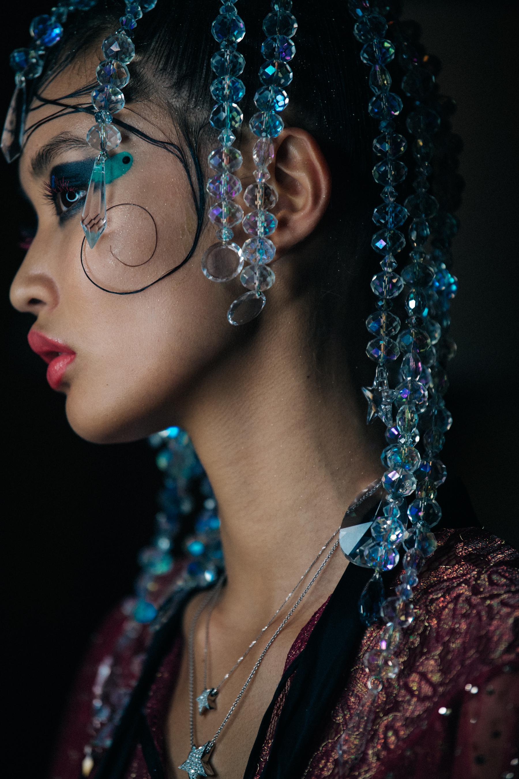 Model with slick styled hair backstage