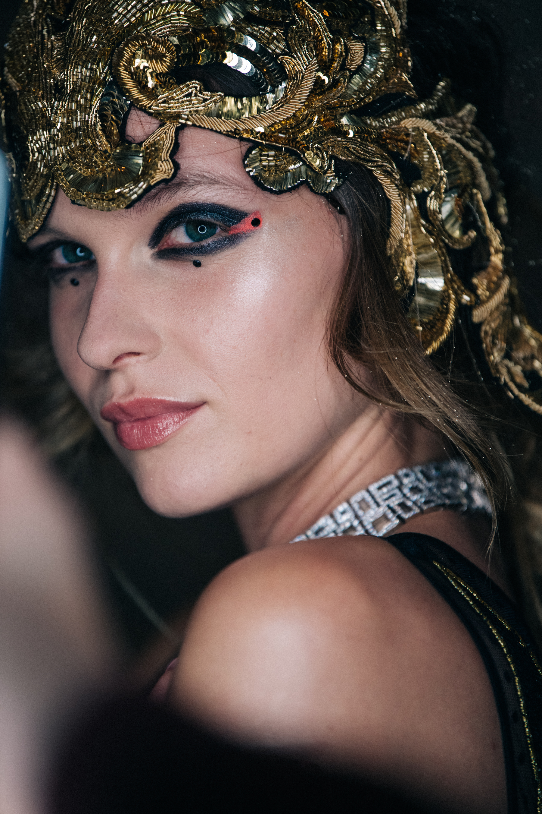 Model wearing metal headdress