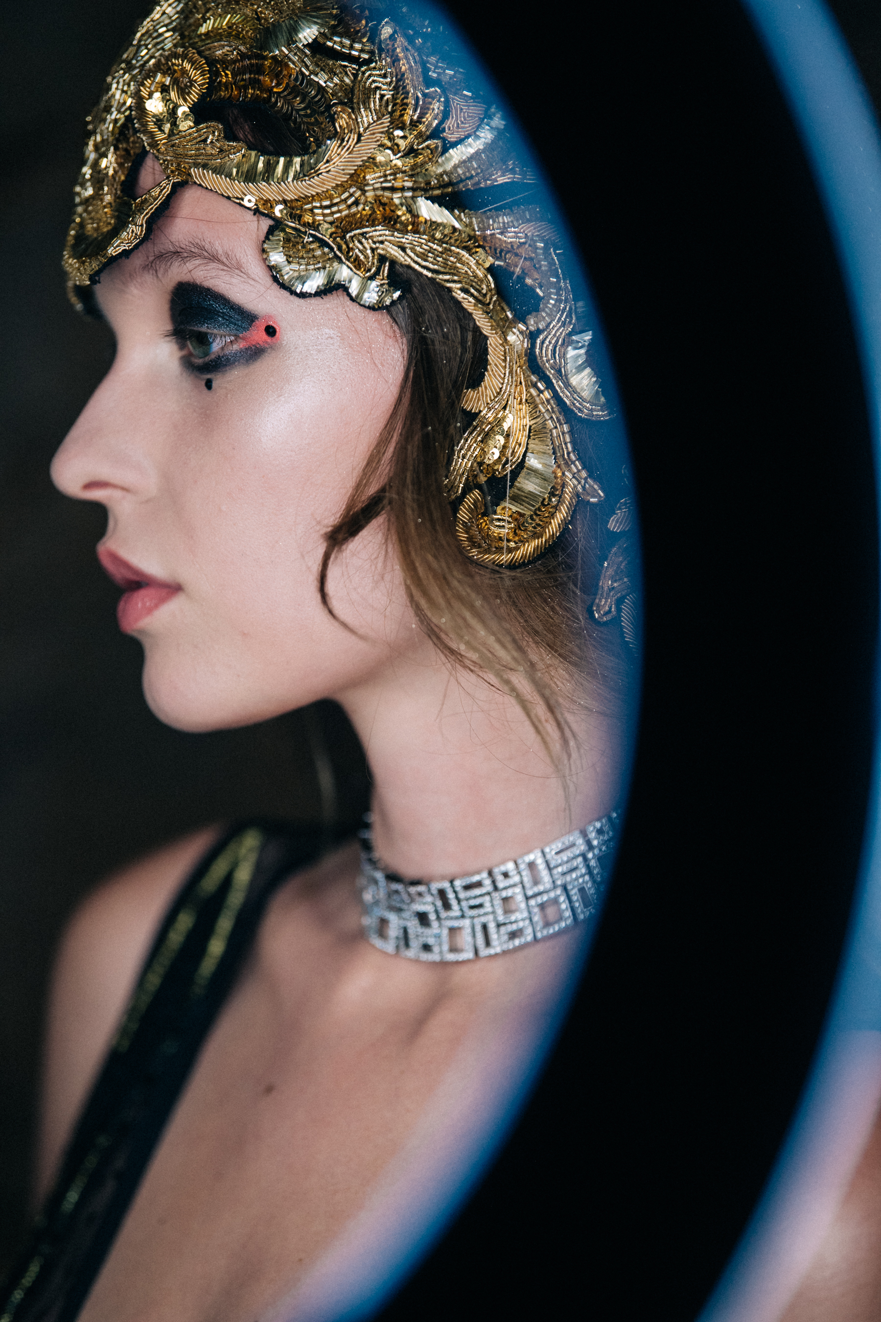 Model wearing metal headdress