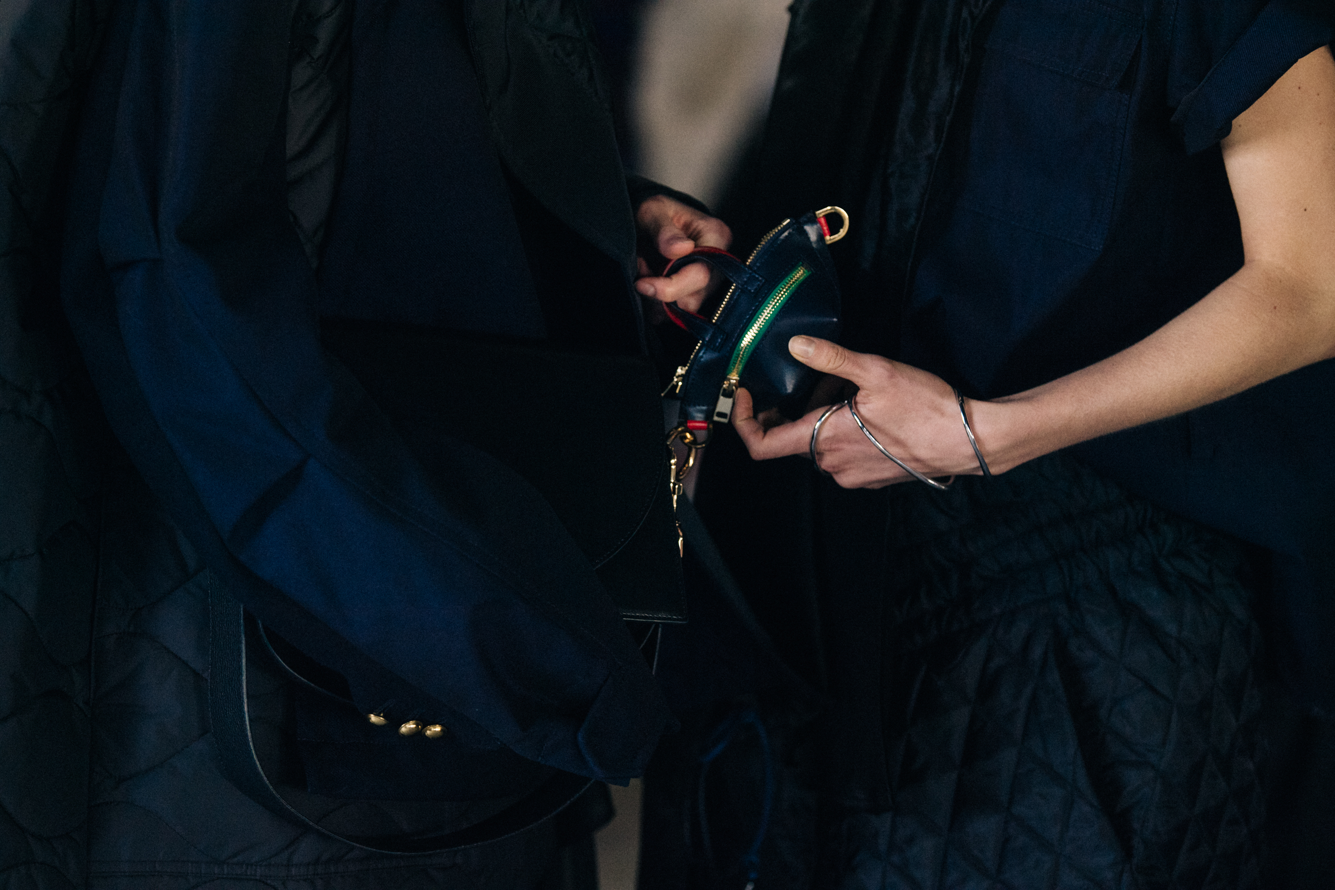 Models carrying Sacai bags