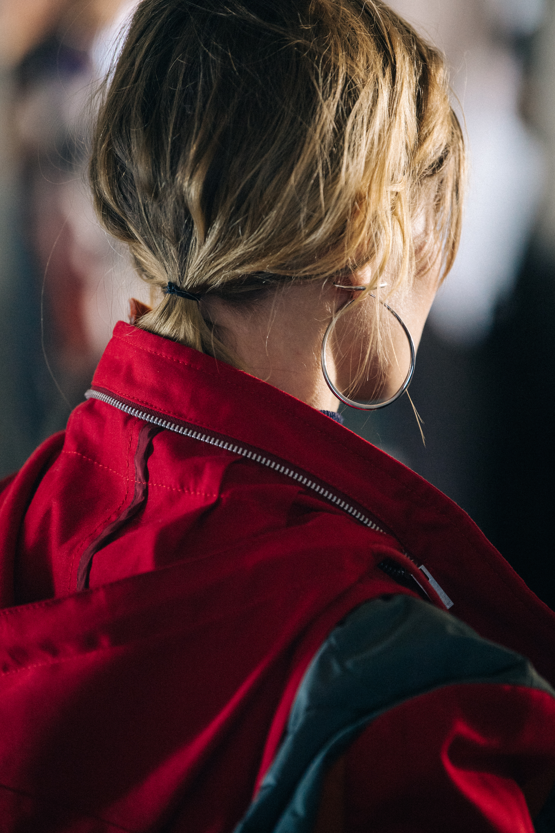 Model wearing red hooded coat