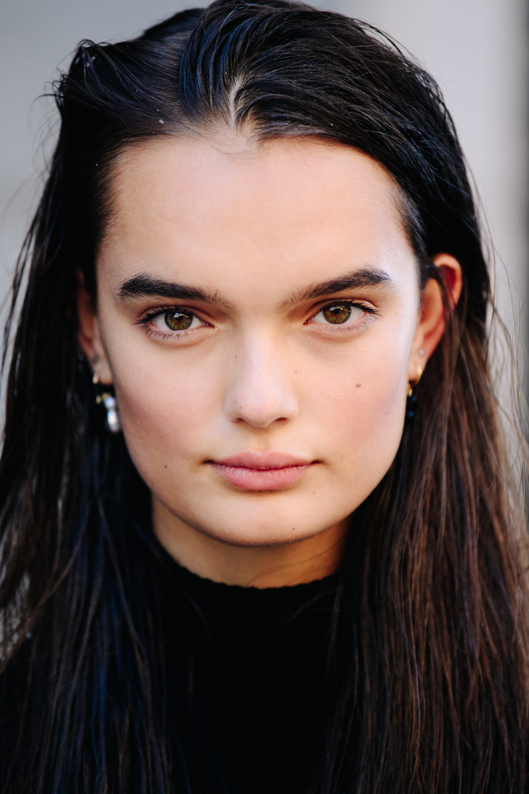 Portrait of model with slick brown hair