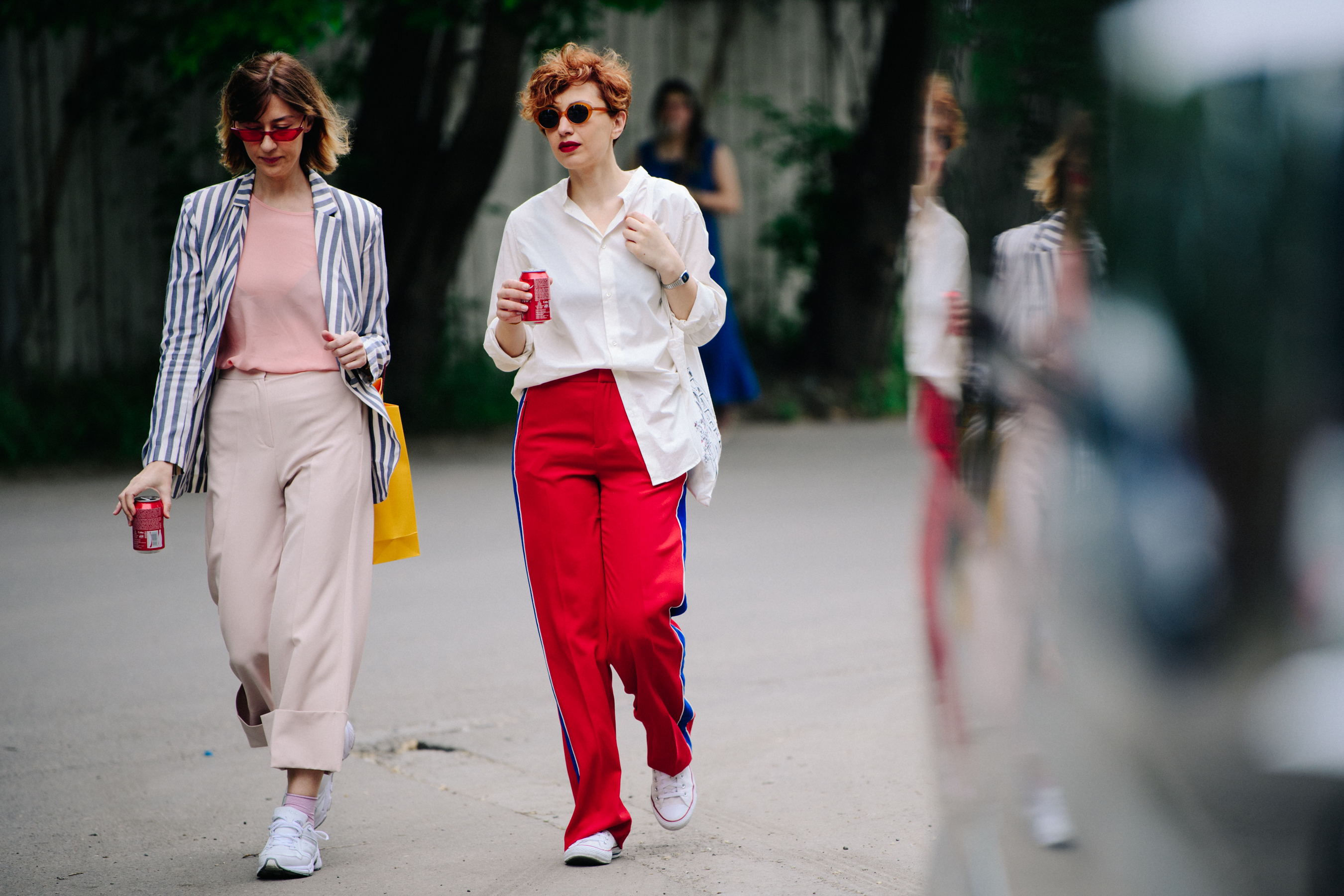 Two women wearing colourful outfits