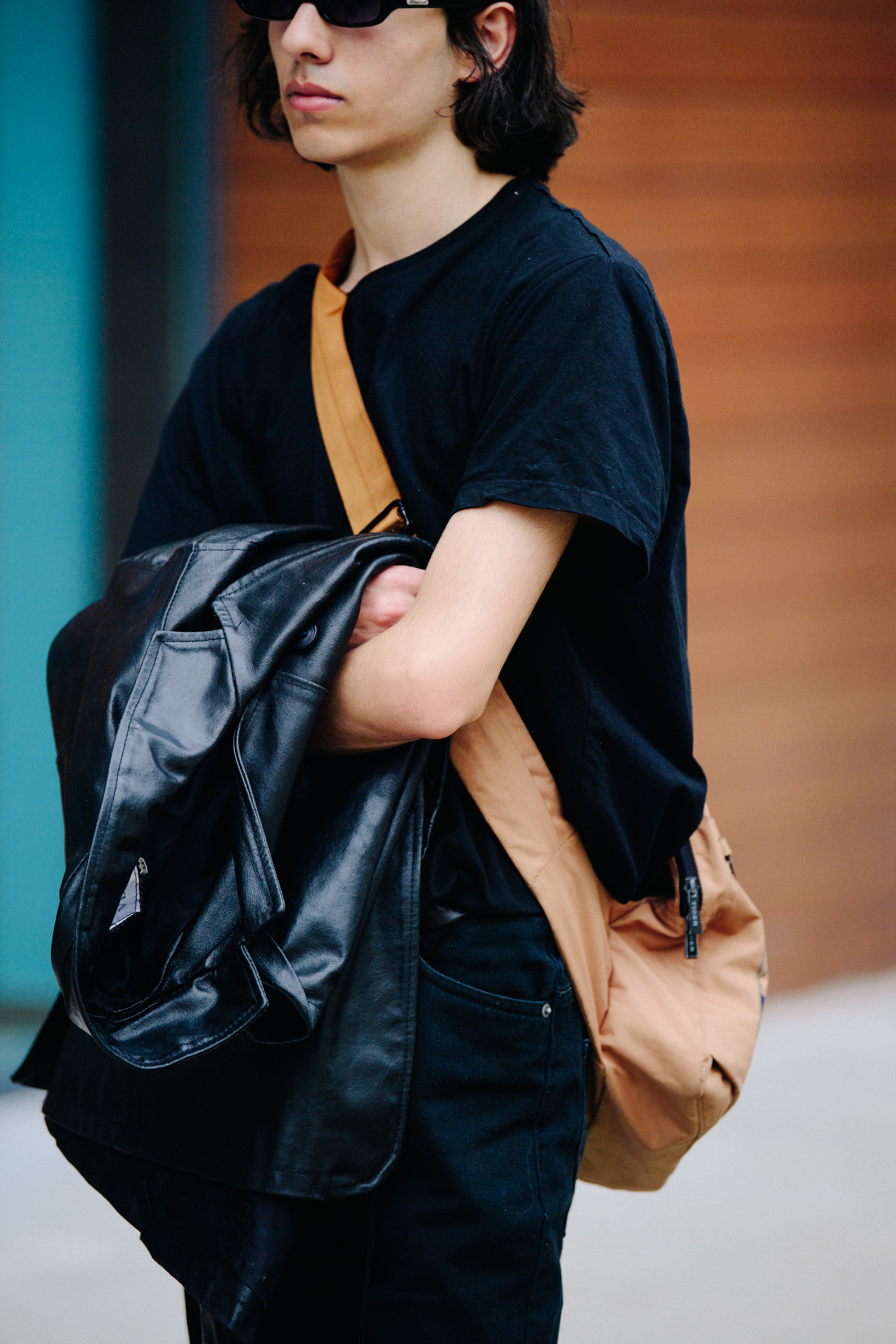Man carrying leather jacket