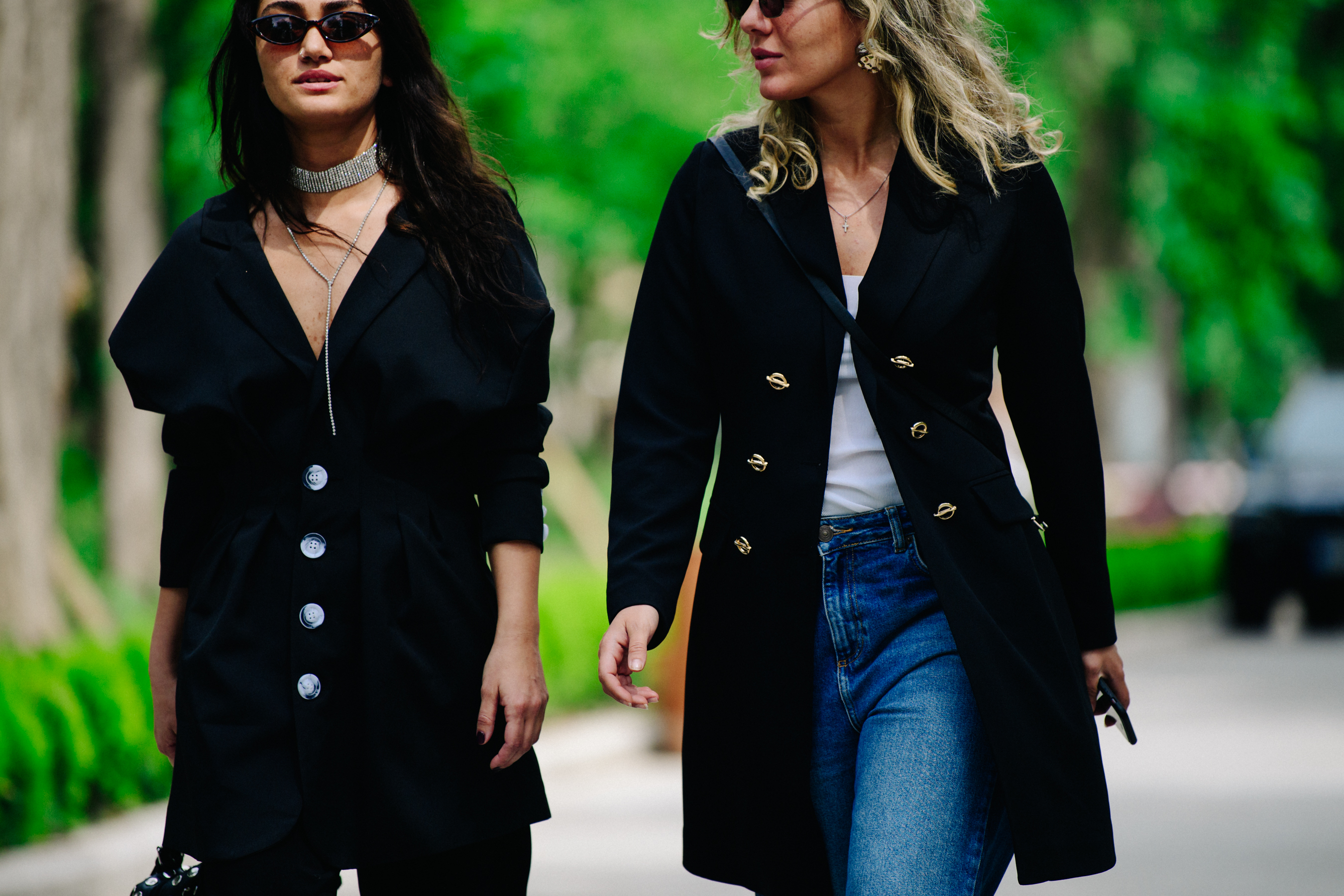 Two women wearing black jackets