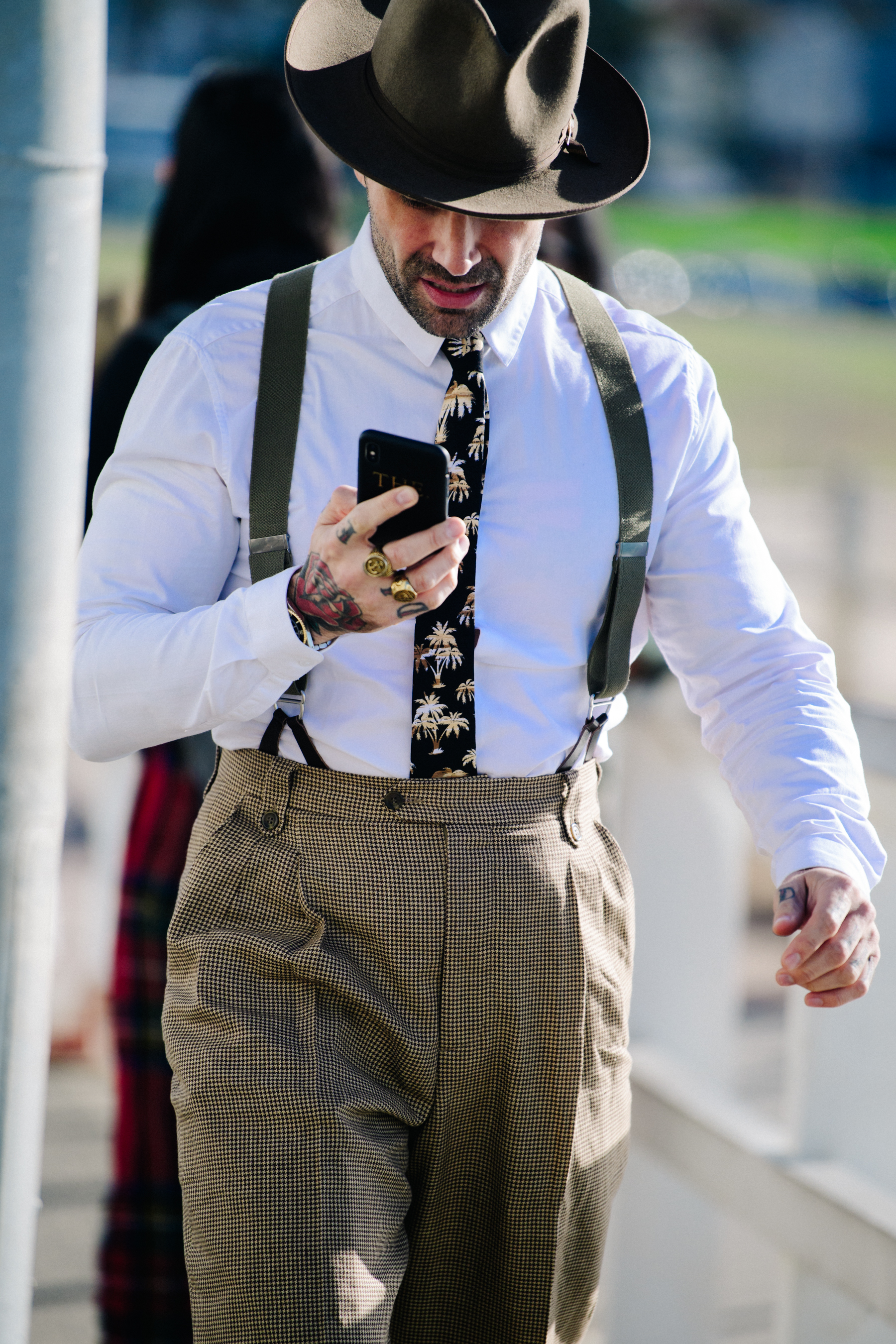 Man wearing bracers and hat