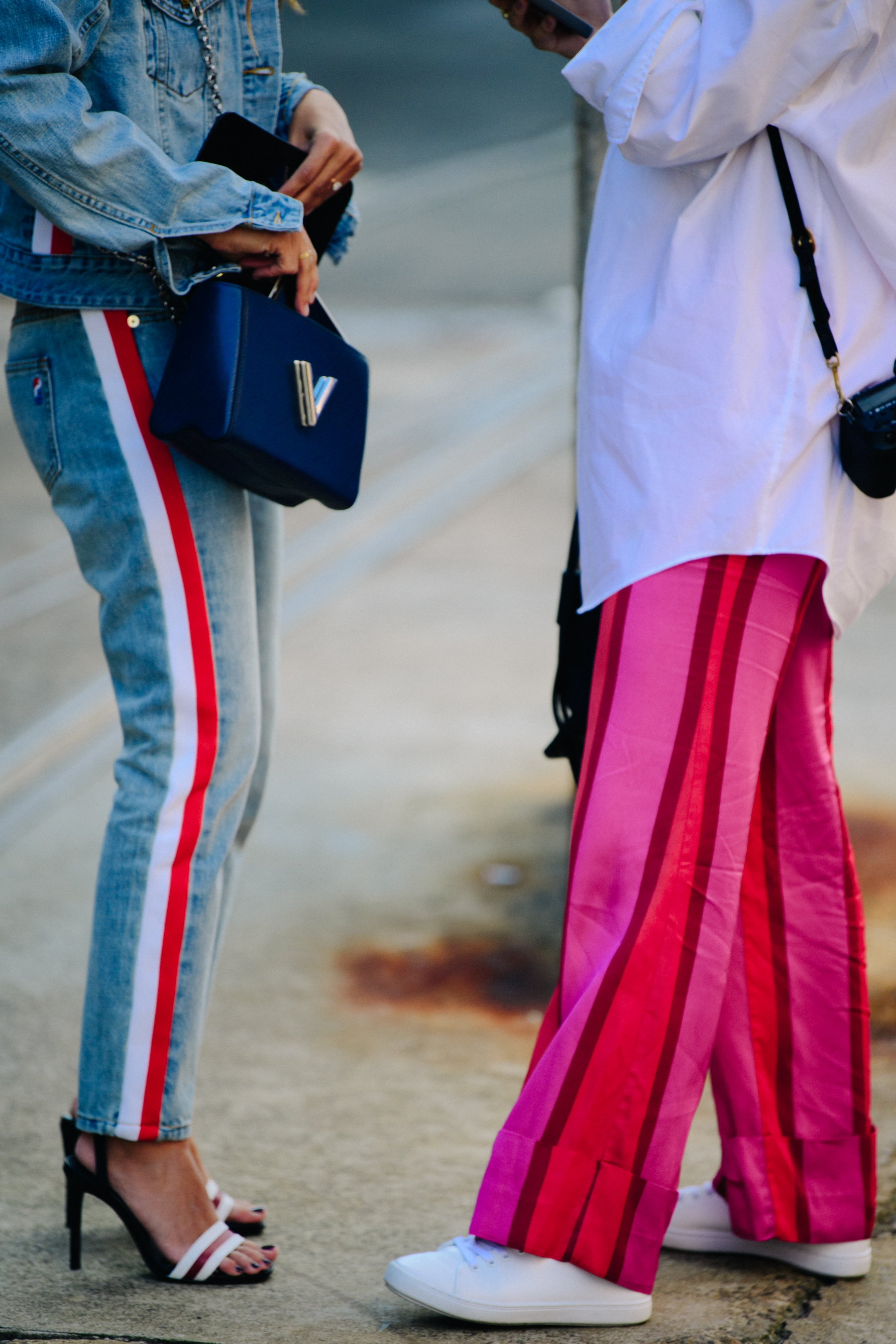 Two women wearing striped pants
