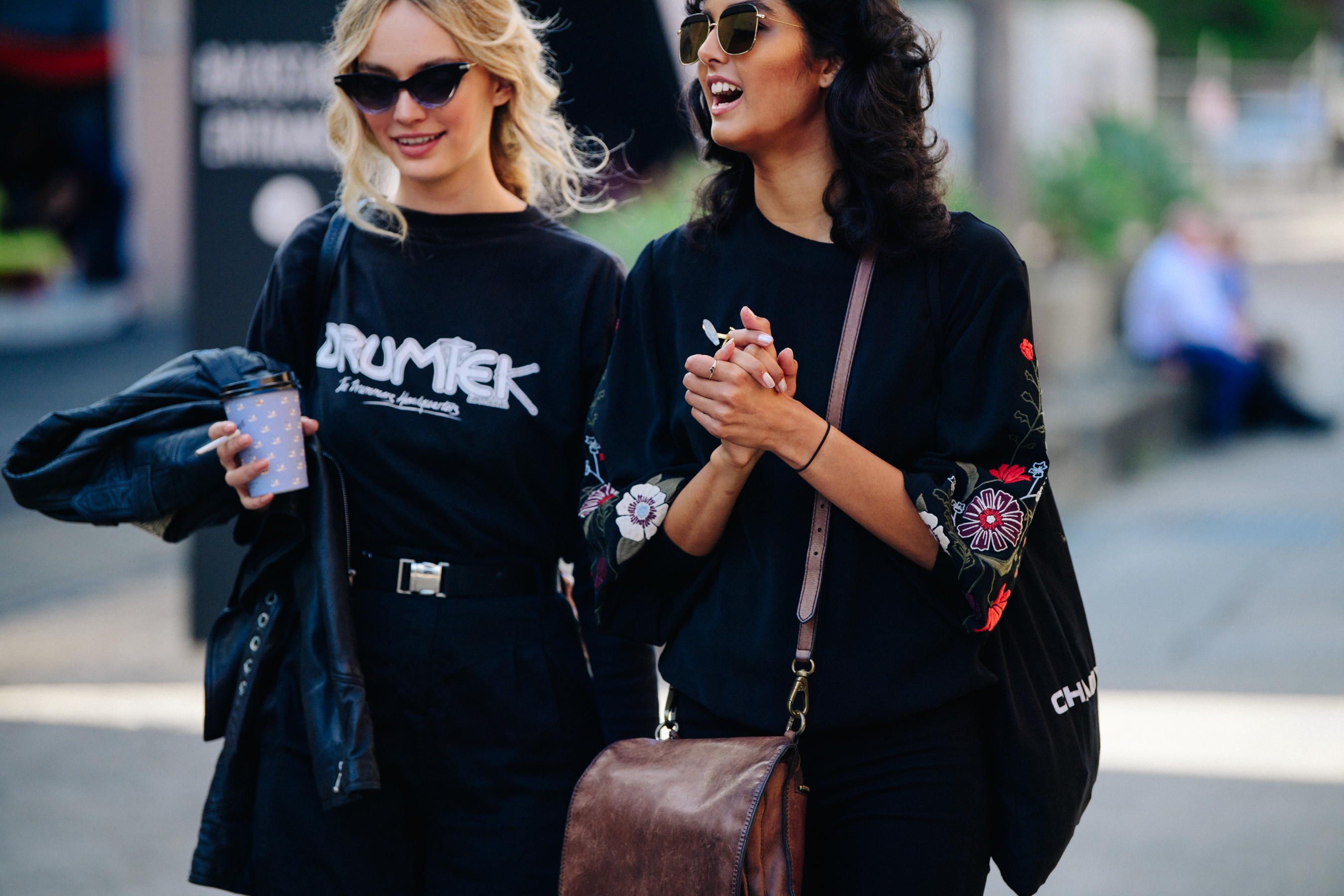 Two women wearing black