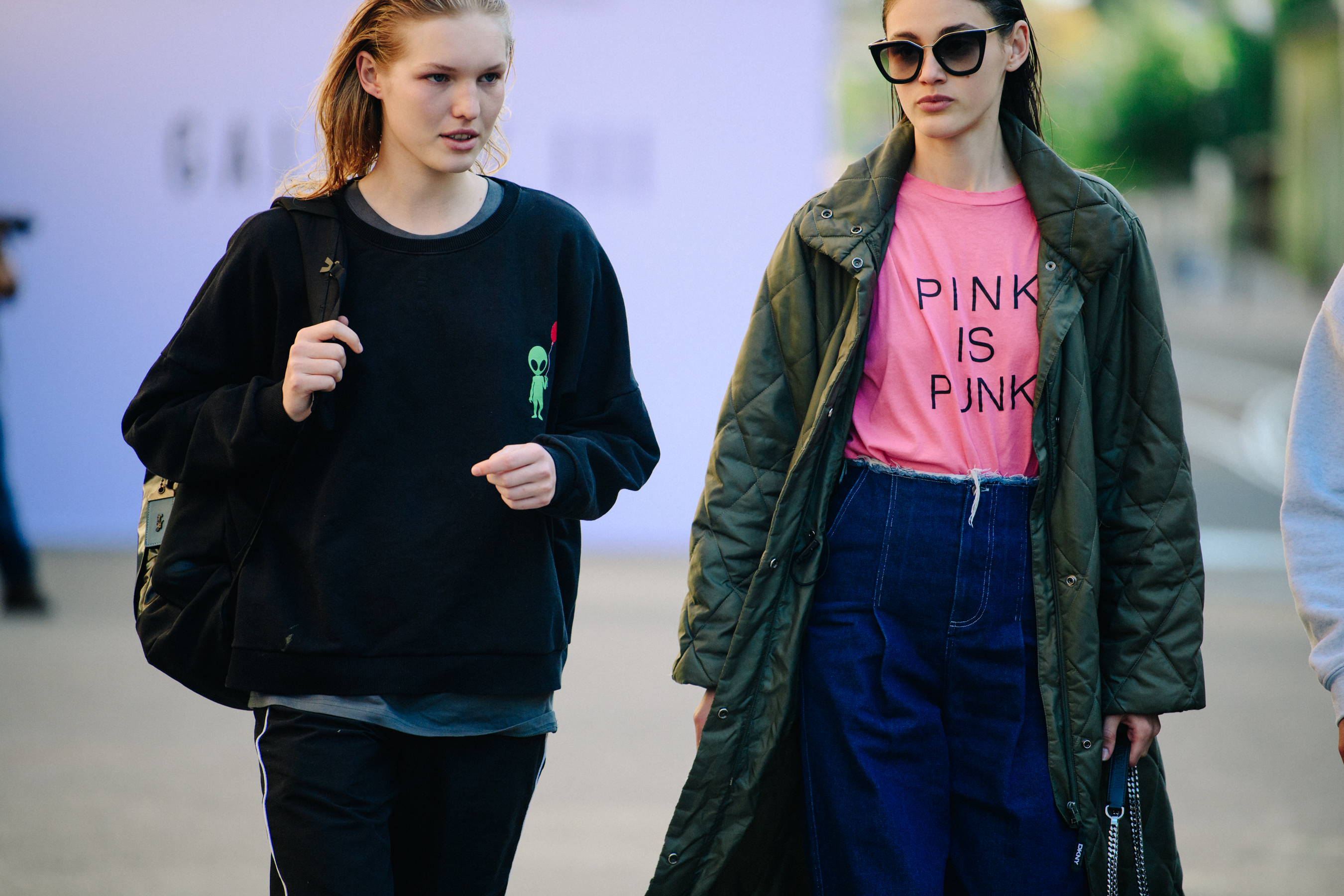 Two models wearing thick clothing