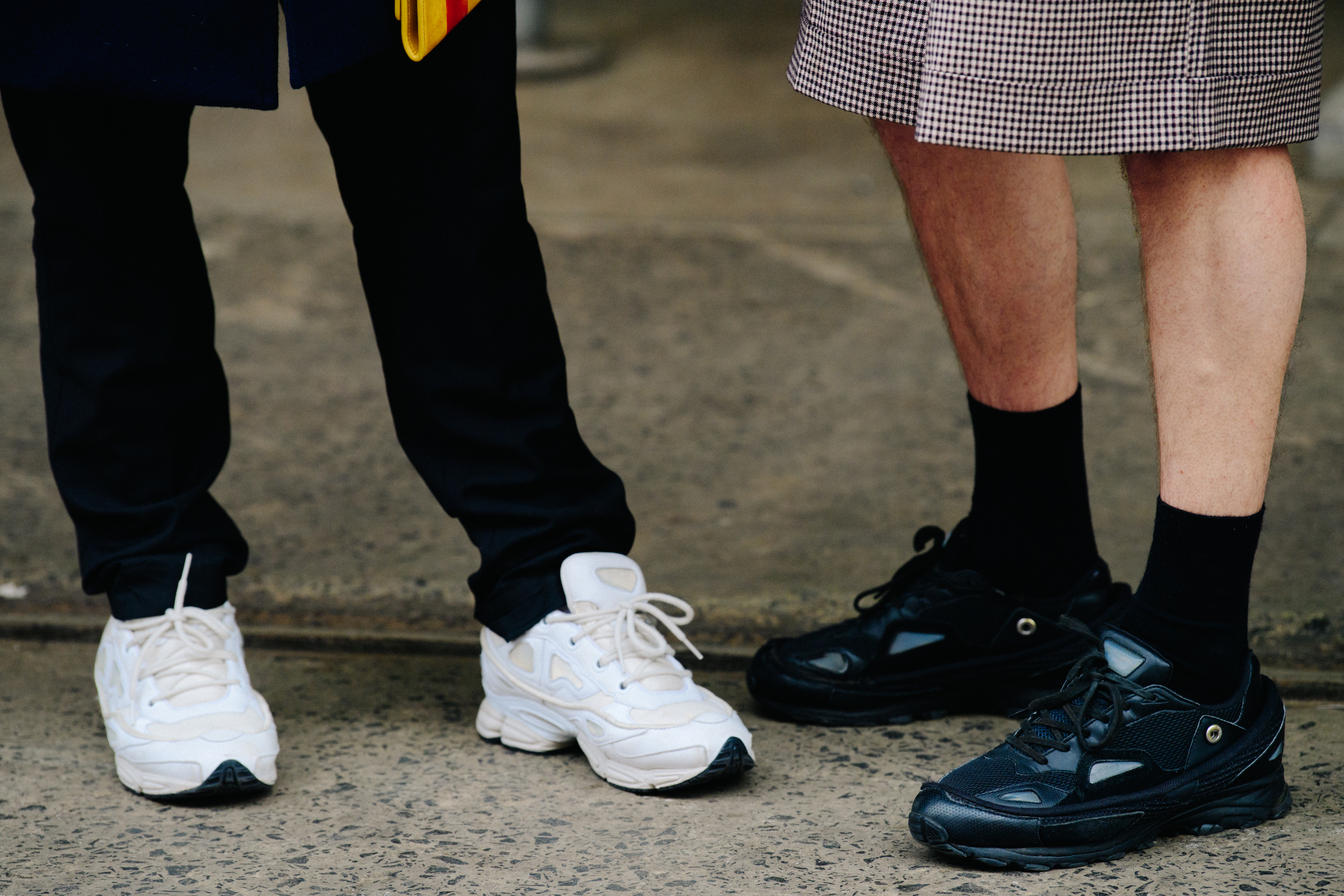 People wearing Raf Simons sneakers