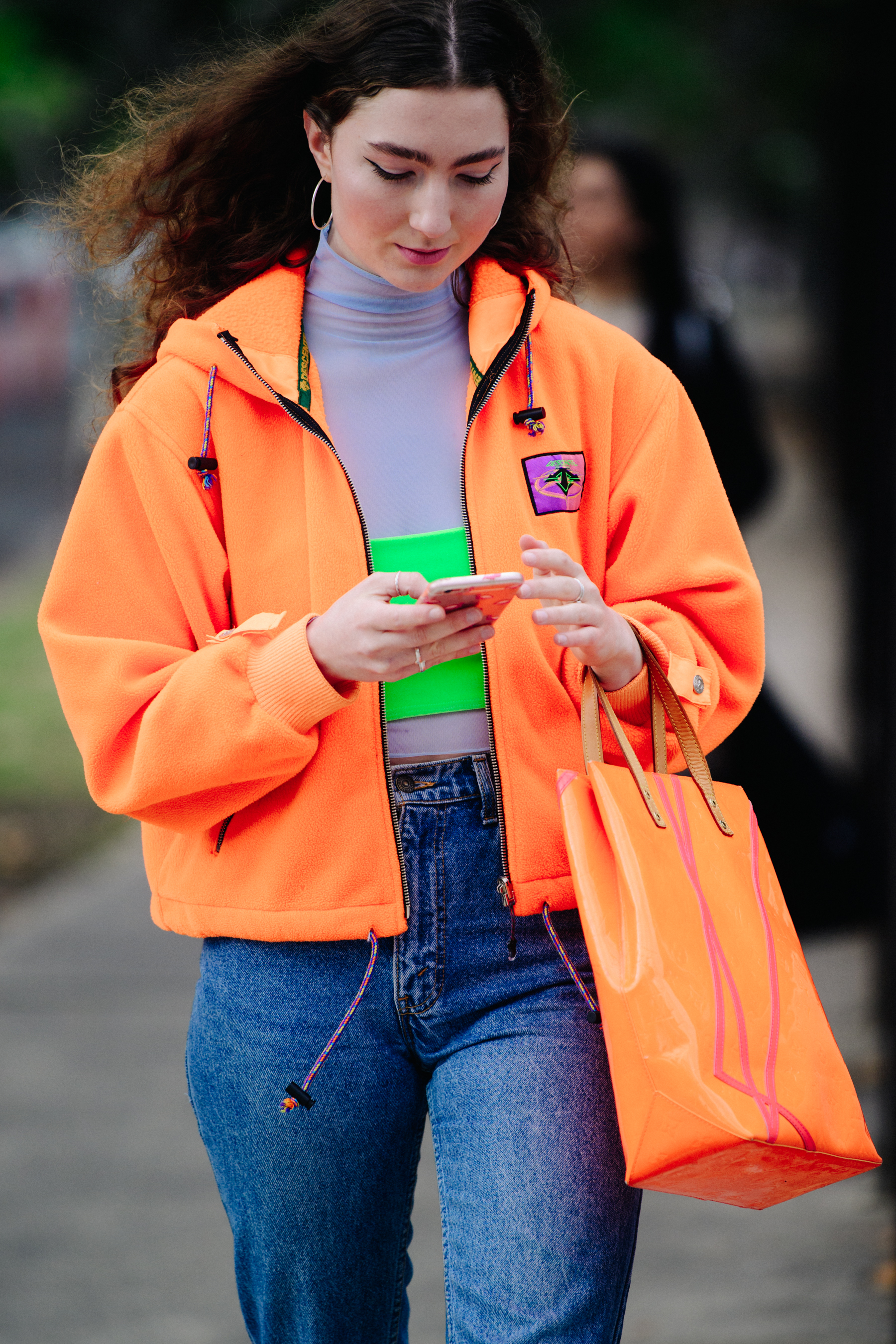 Woman wearing orange jacket