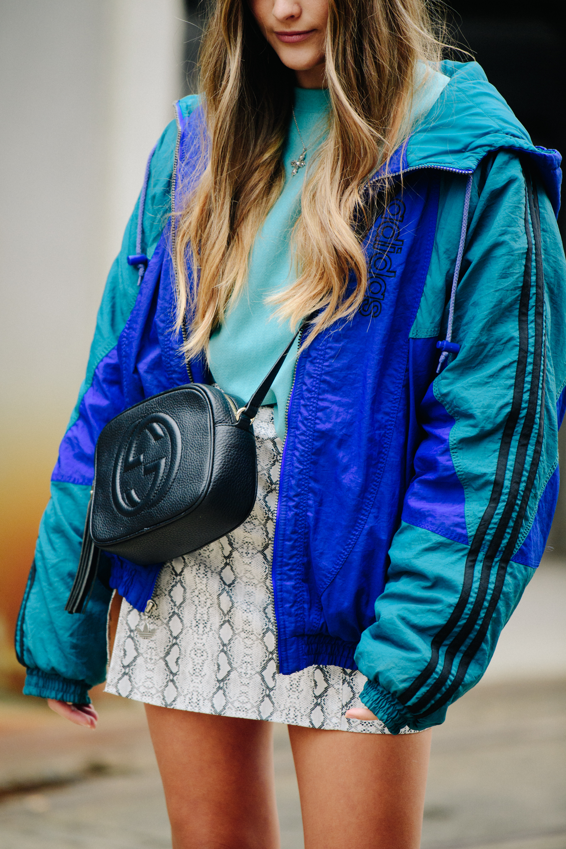 Woman wearing blue sports jacket