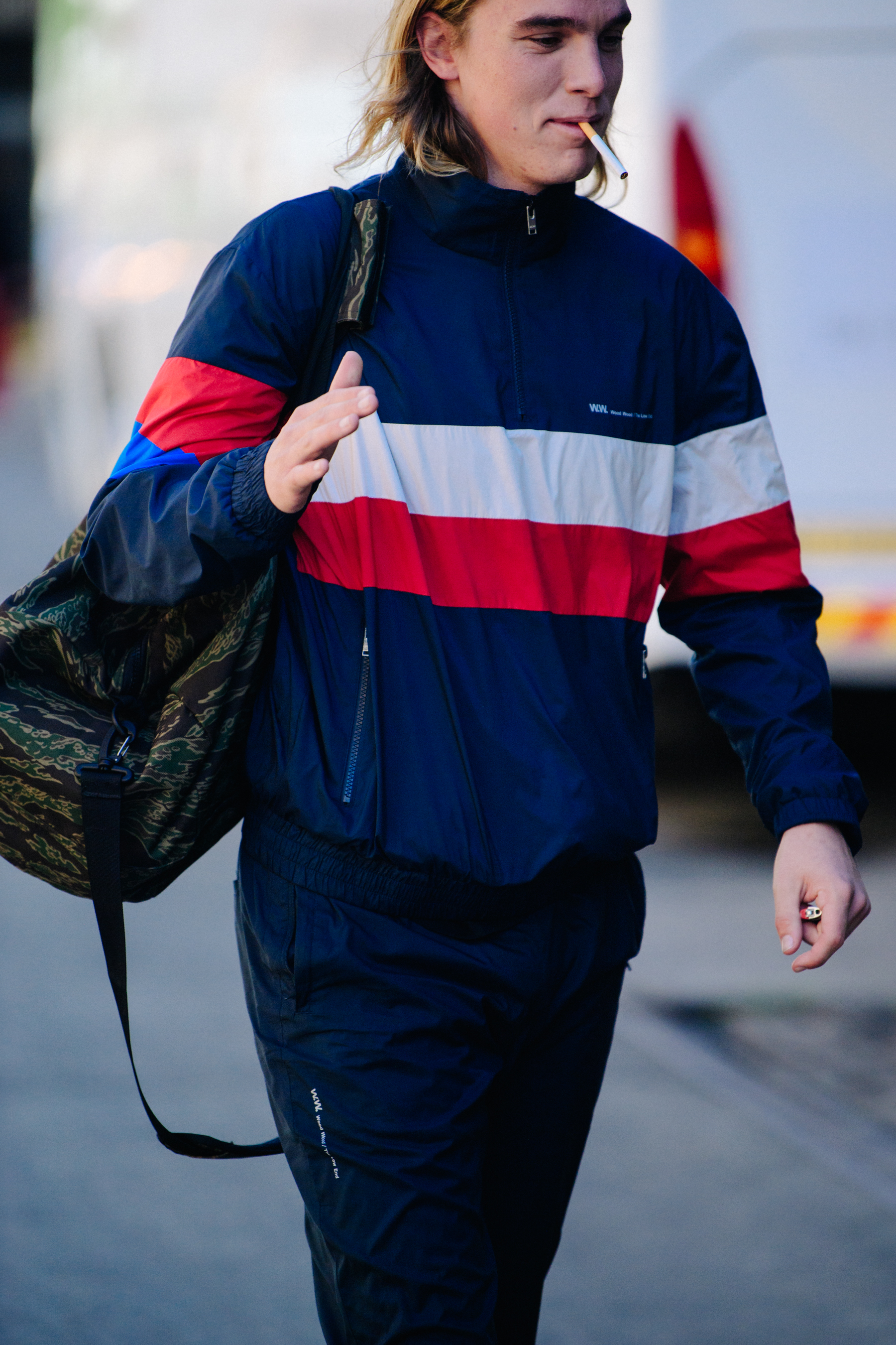 Man wearing blue striped sports top