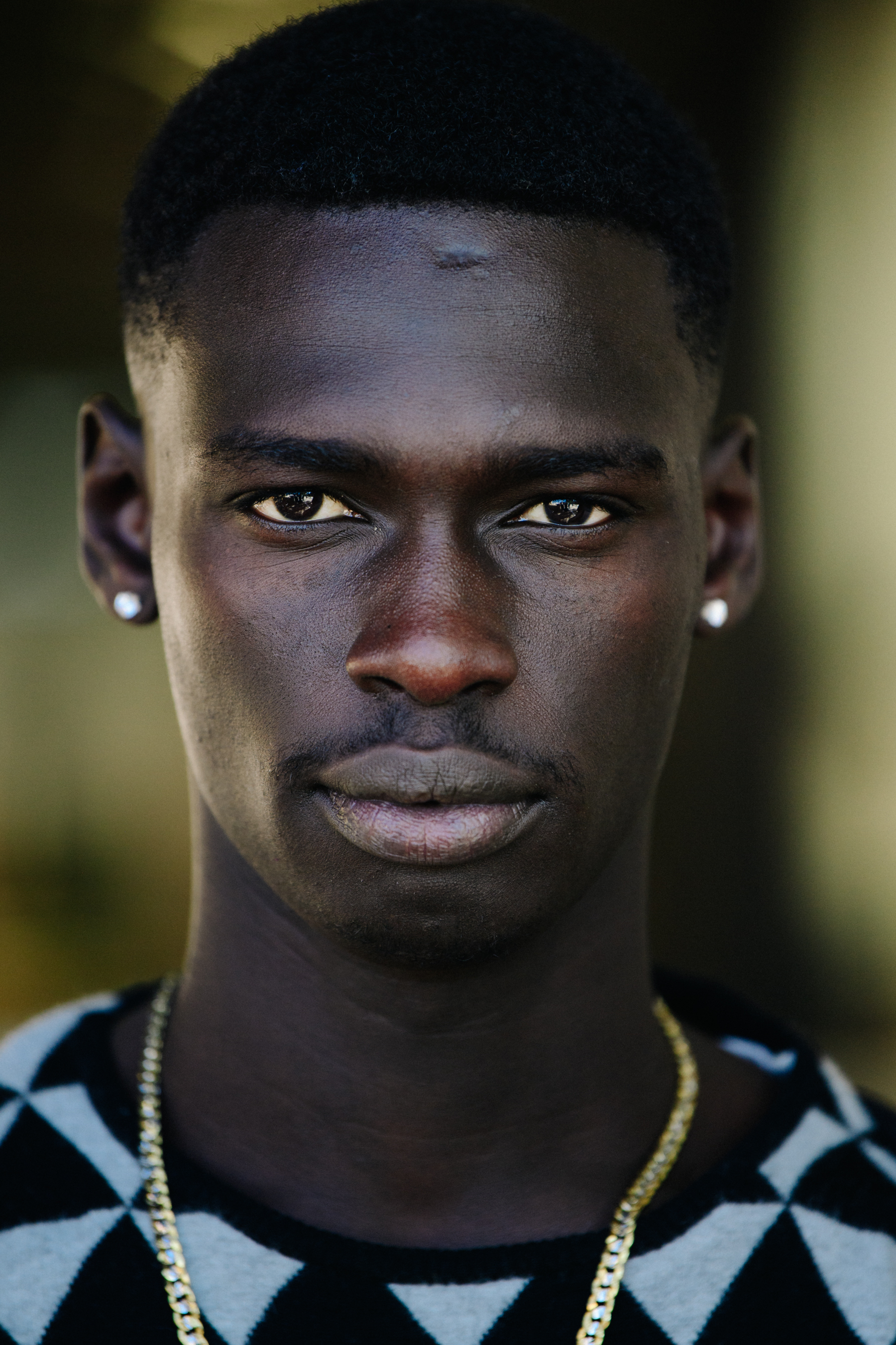 Portrait of black male model with shaved head