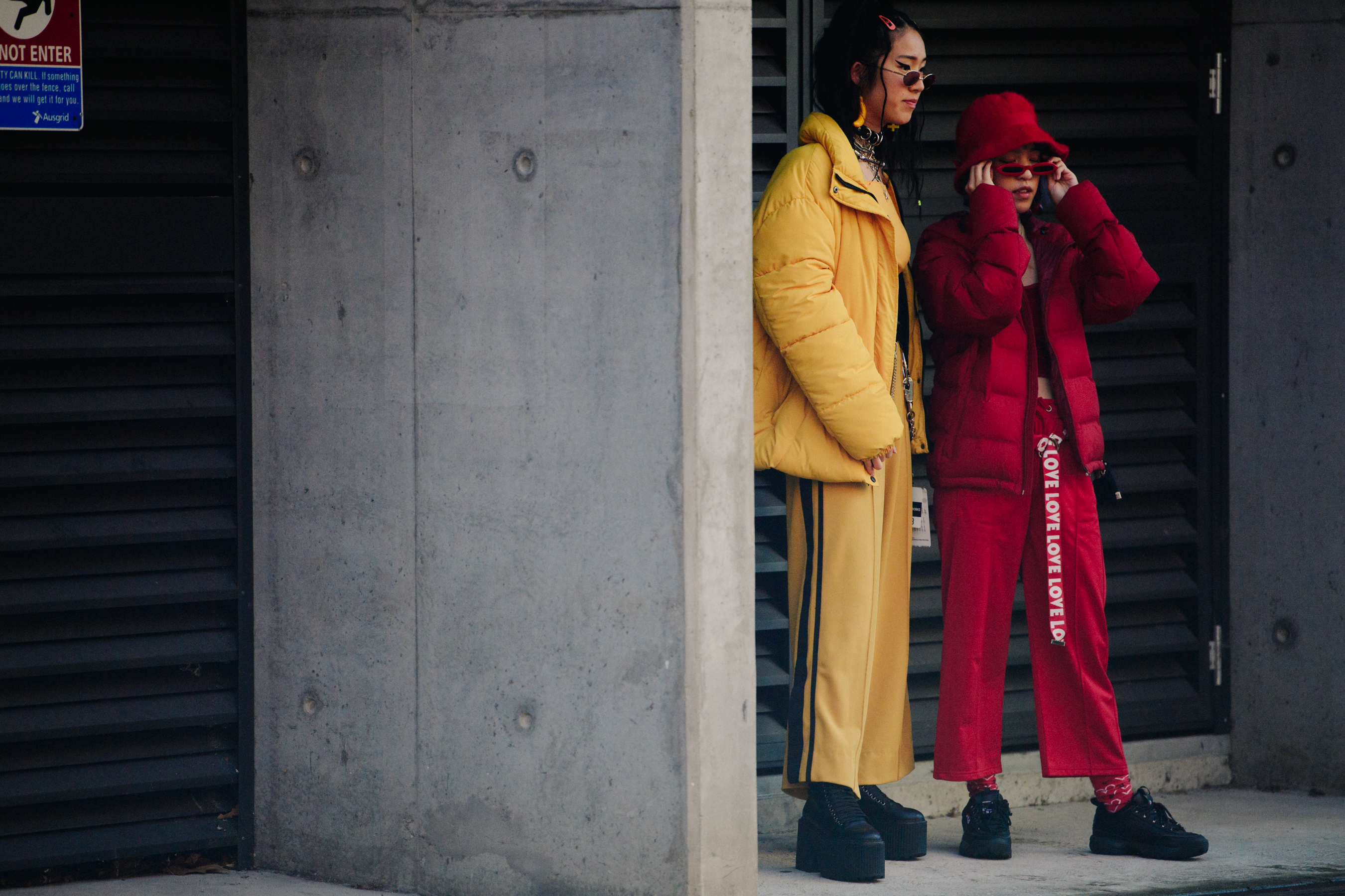 Two girls wearing bright coloured outfits
