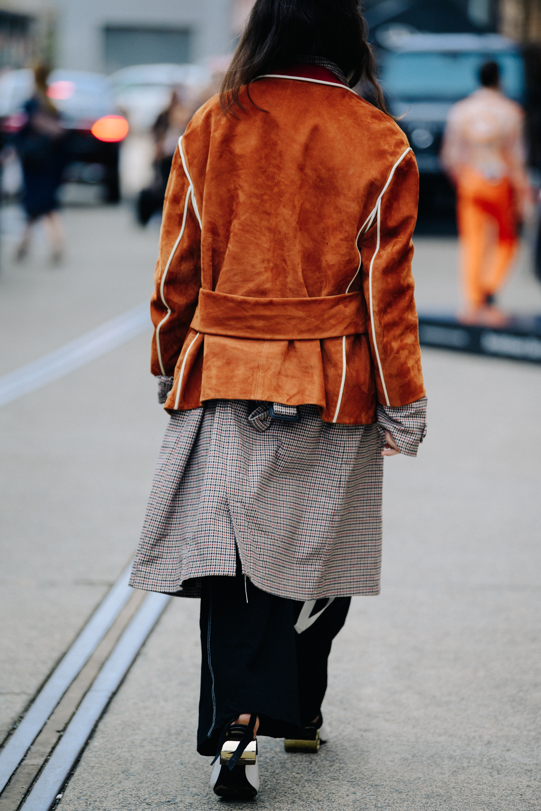 Woman wearing brown jacket
