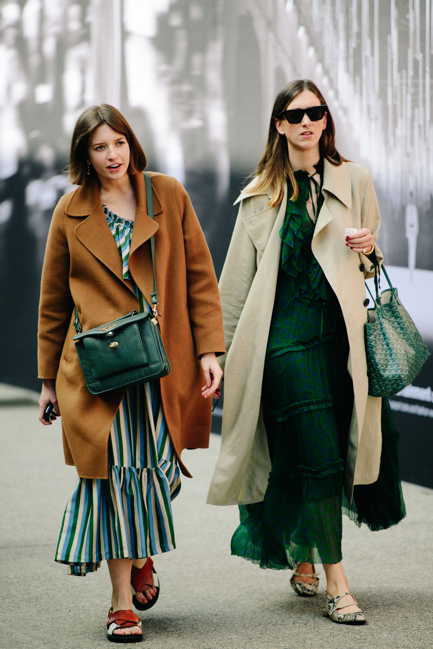 Two women wearing long dresses