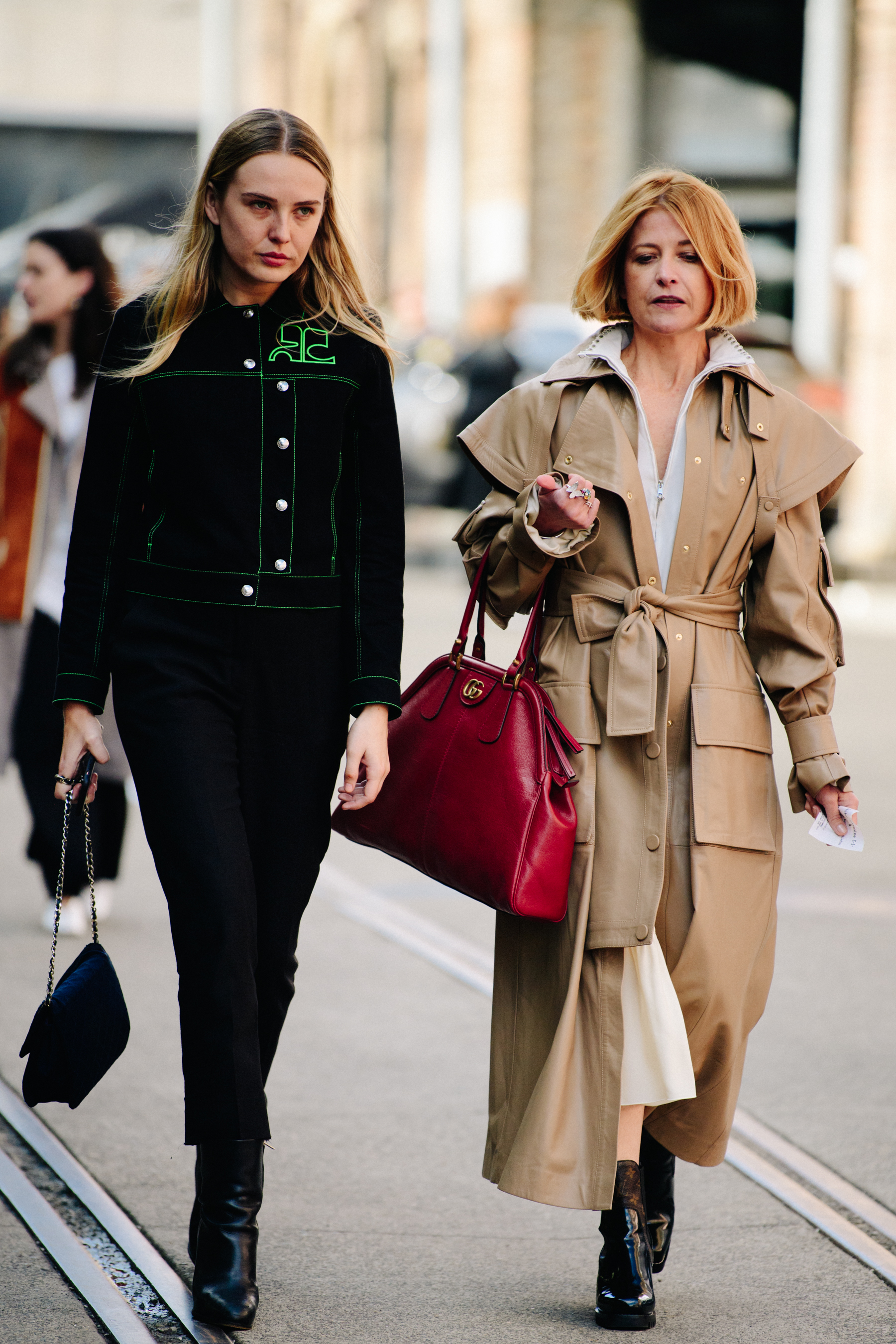 Two women wearing fashionable clothing