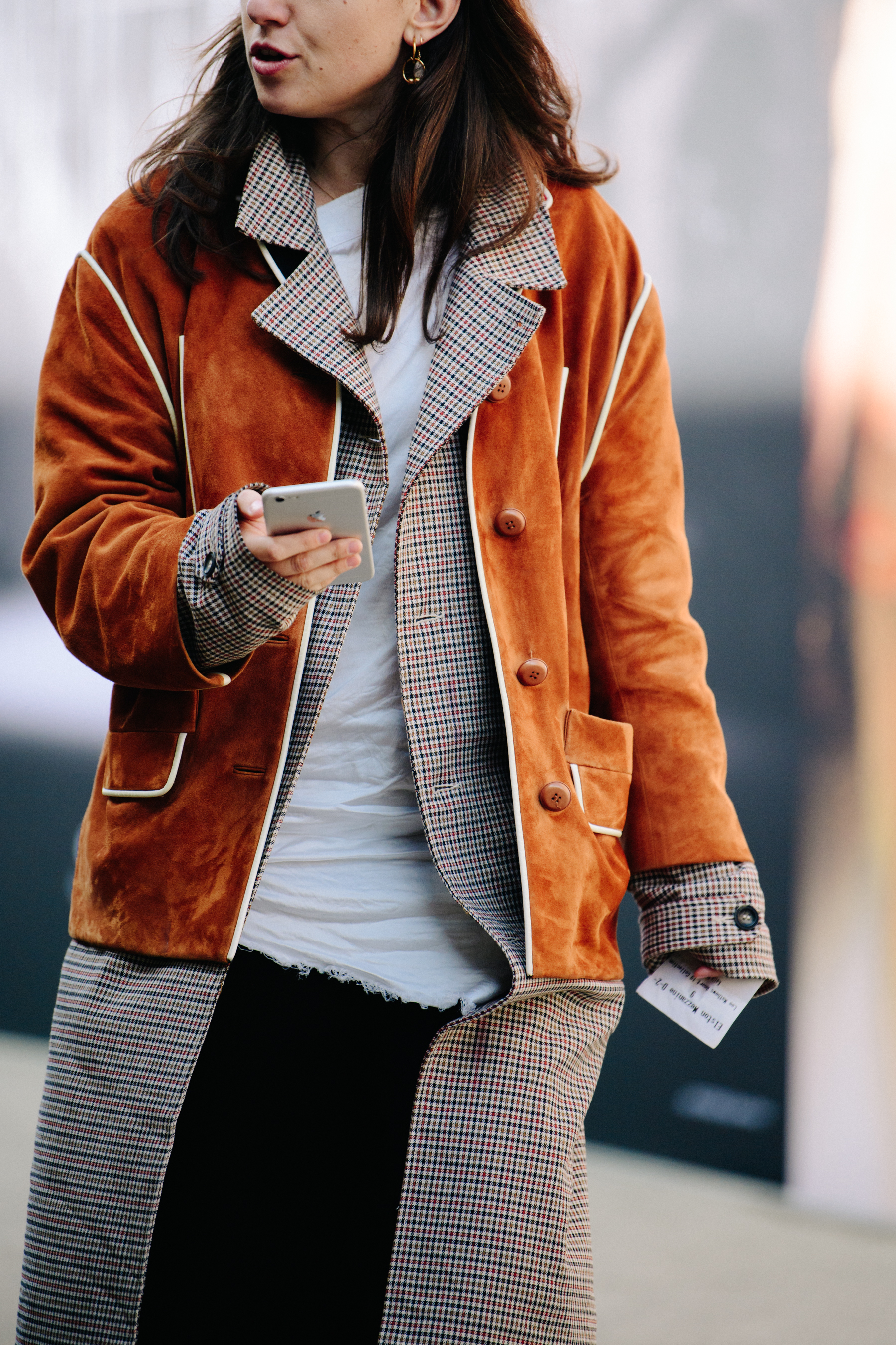 Woman wearing brown suede jacket