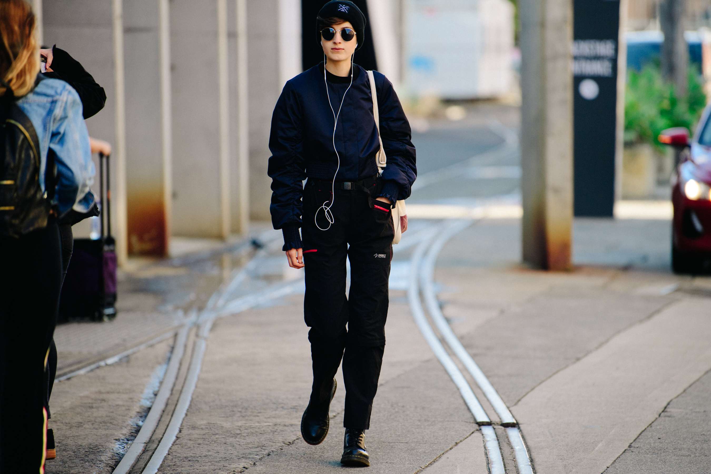 Model wearing dark navy bomber