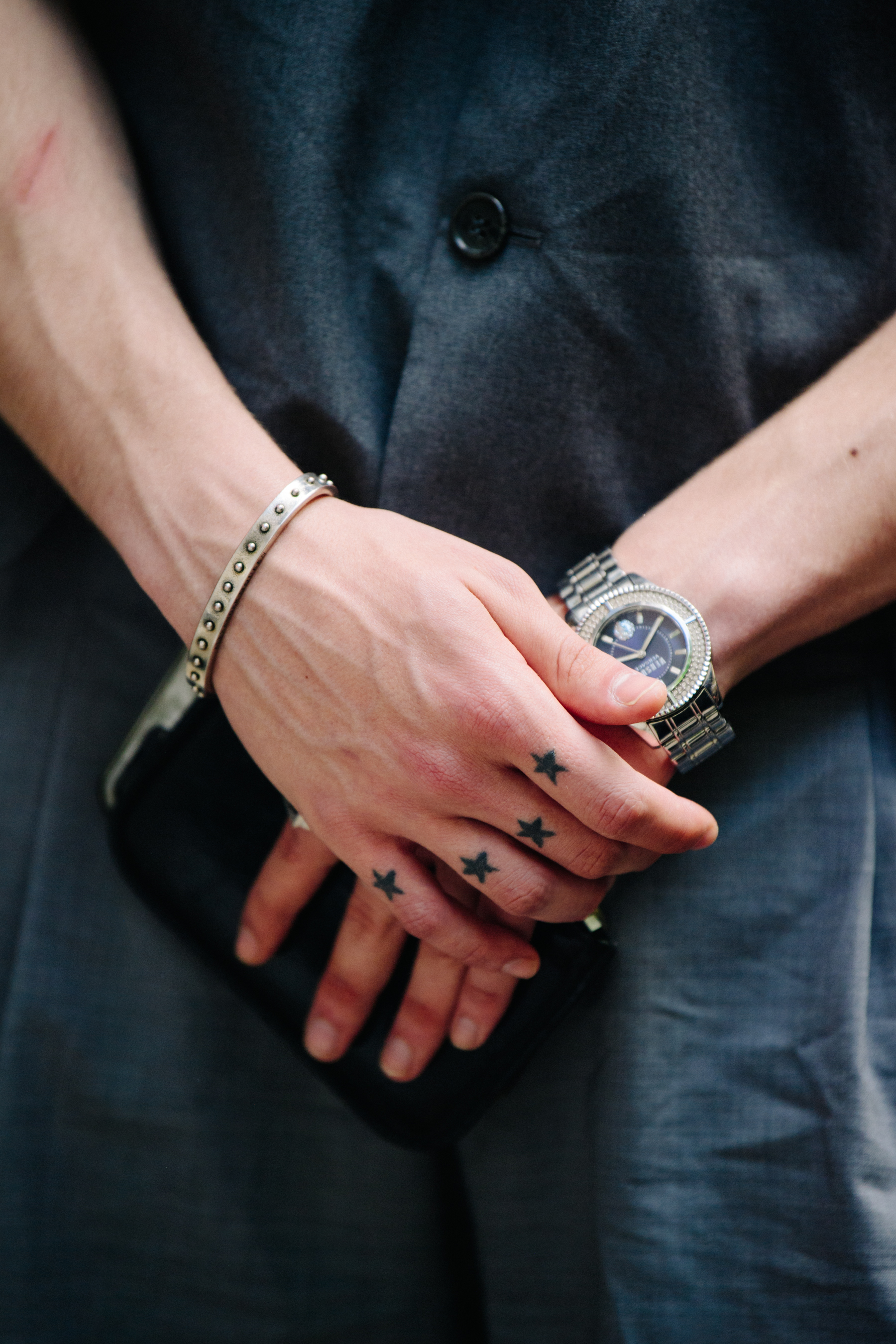 Man wearing silver watch