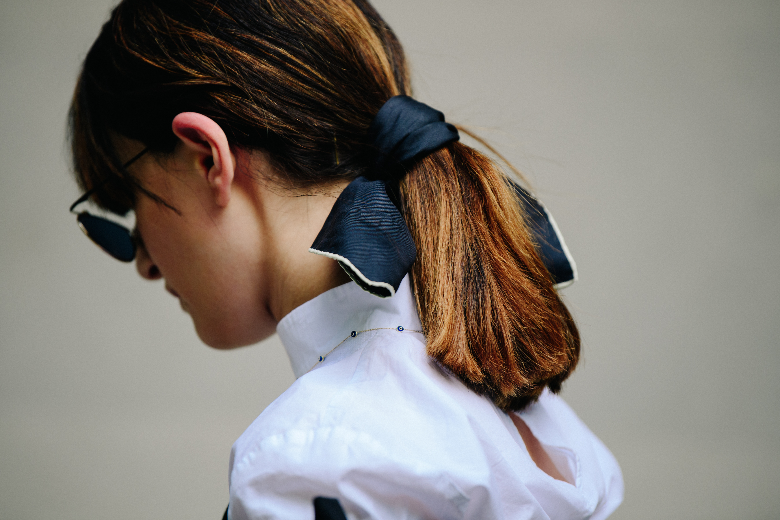 Woman with black bow tied in hair
