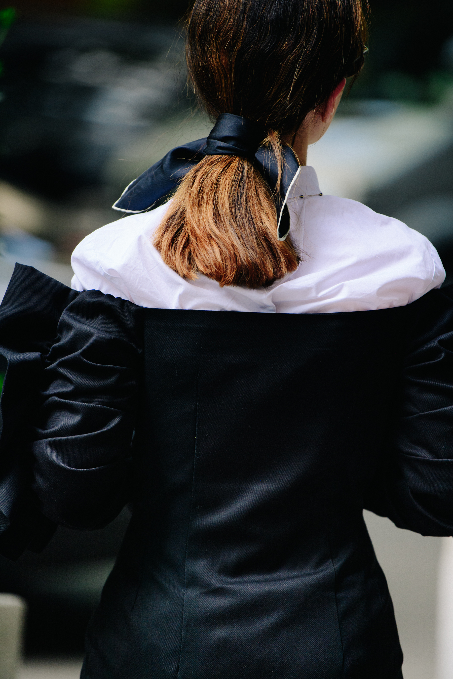 Woman with black bow tied in hair