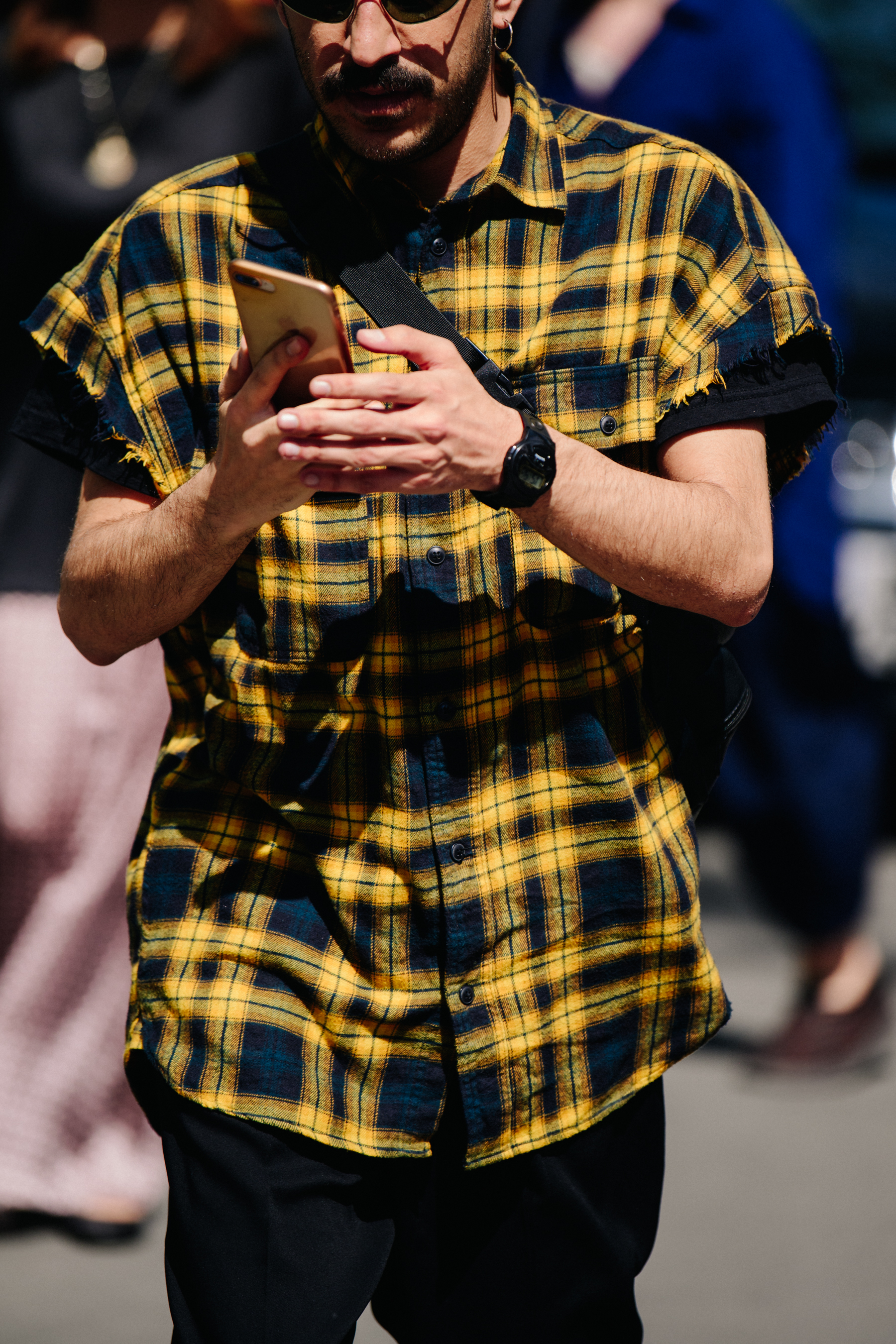 Man wearing yellow check shirt