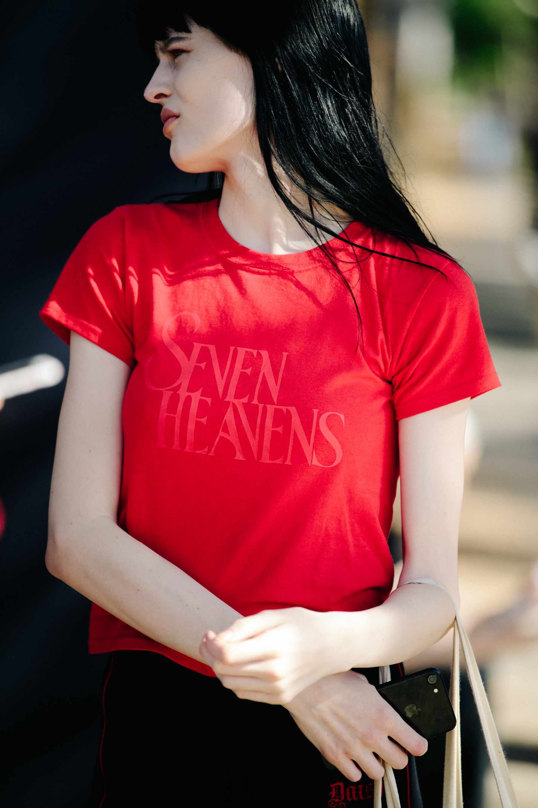 Model wearing red tee shirt