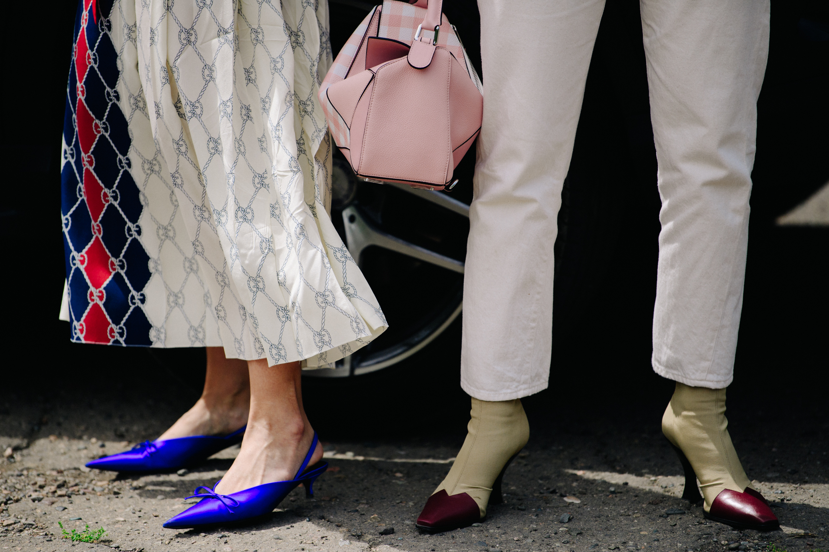 Two women wearing high heels