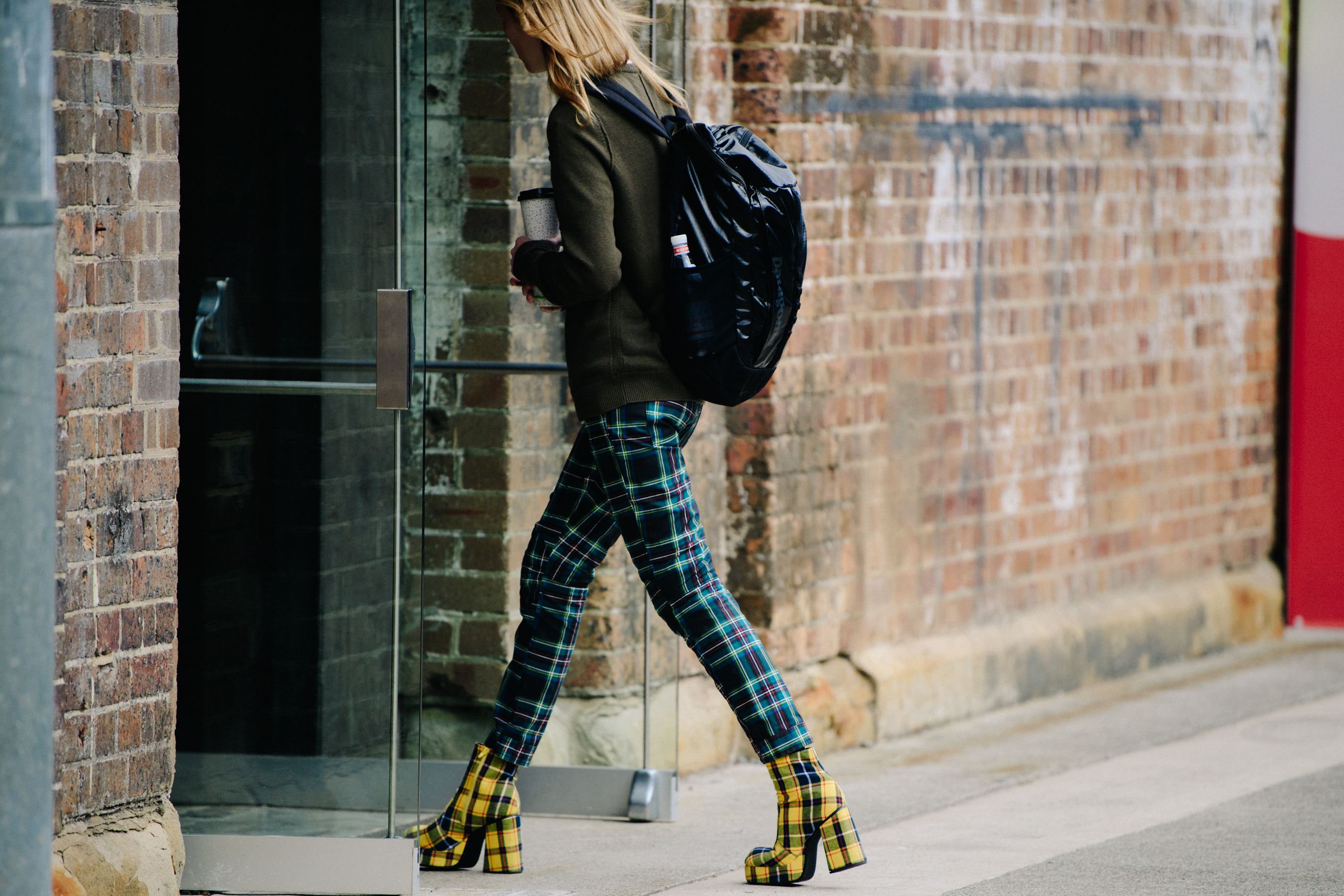 Model wearing check trousers