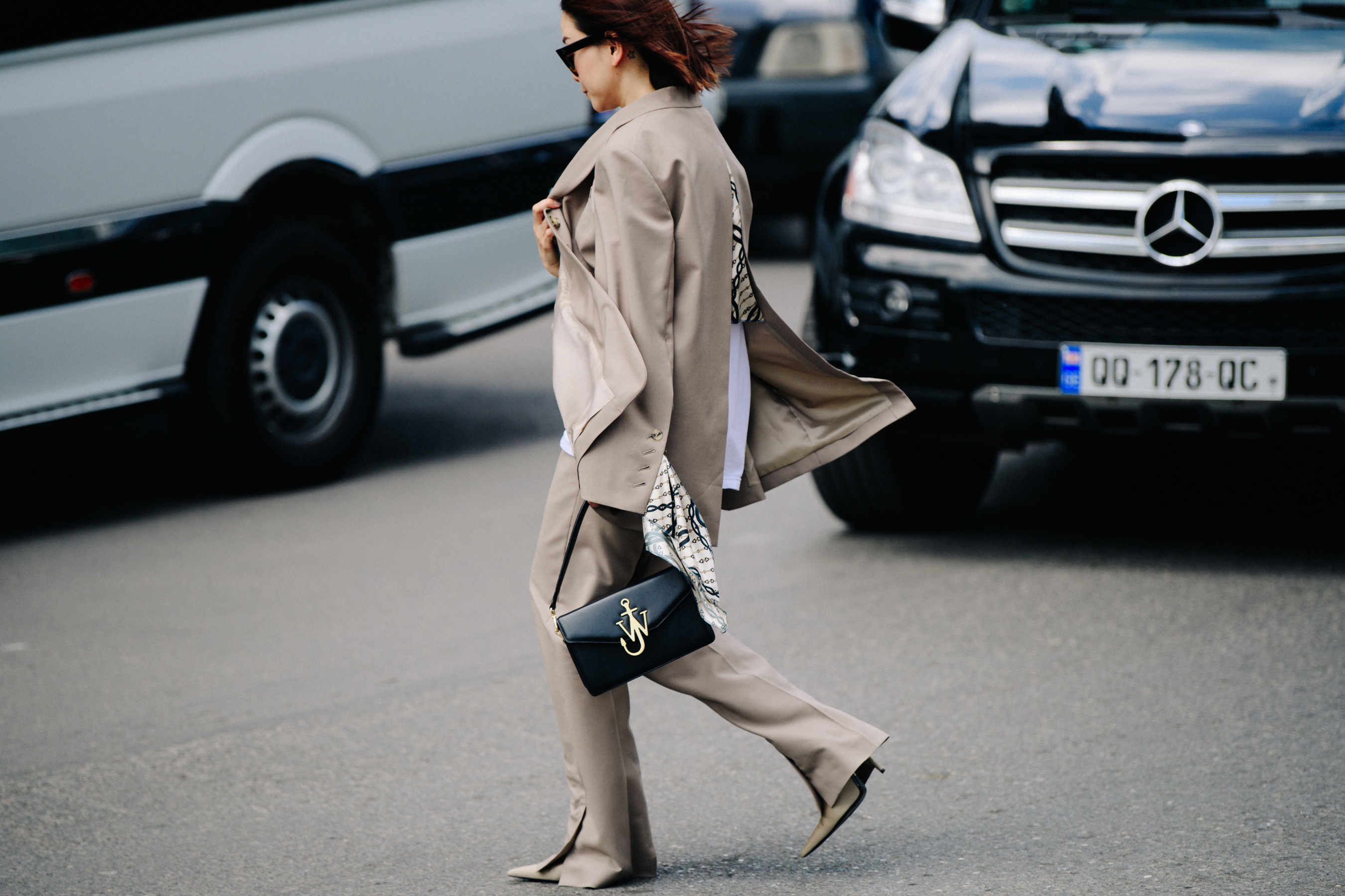 Asian woman wearing brown suit