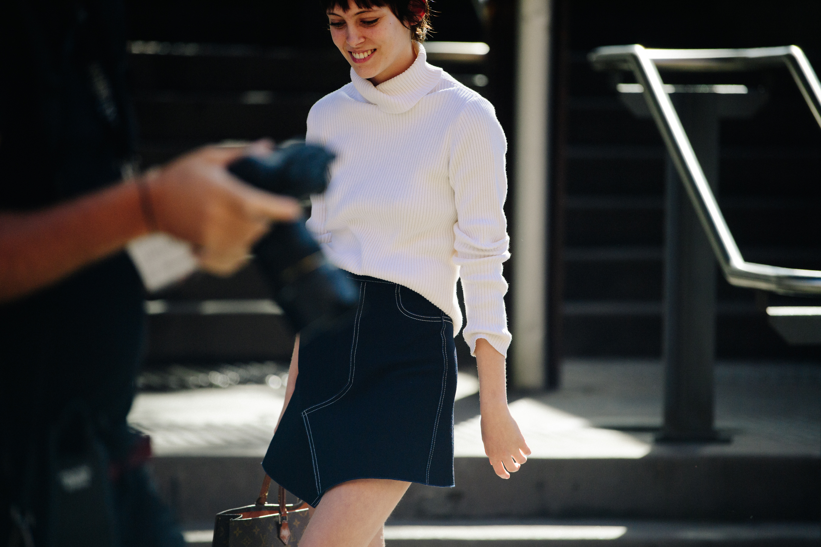 Australian model wearing white top