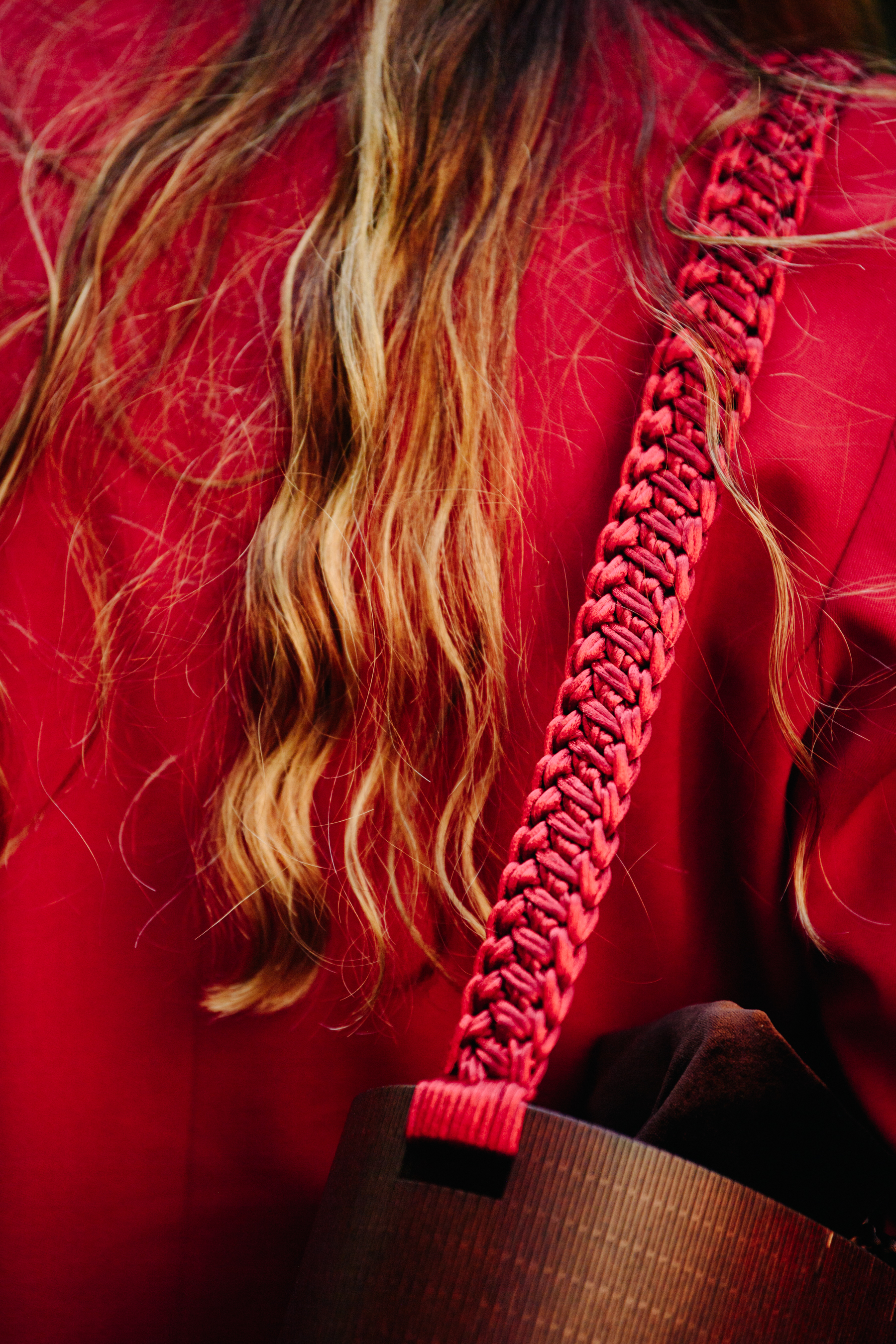Woman carrying red bag