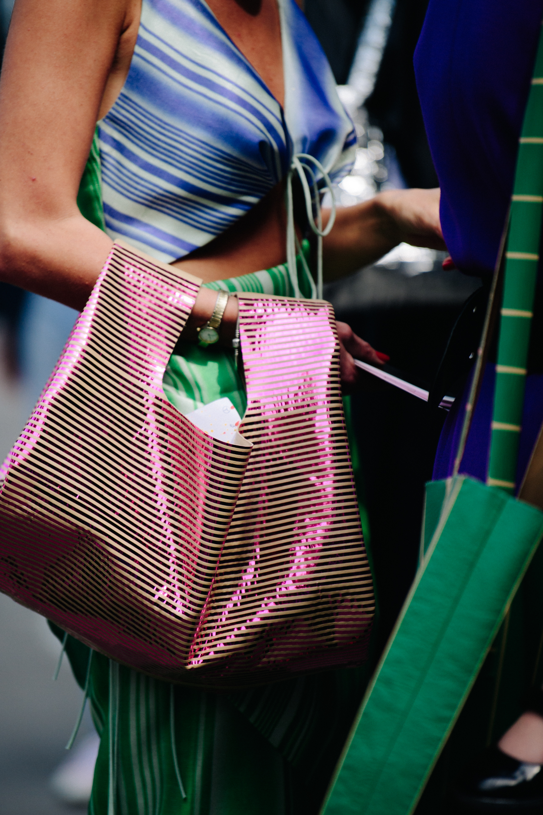Woman carrying colourful bag