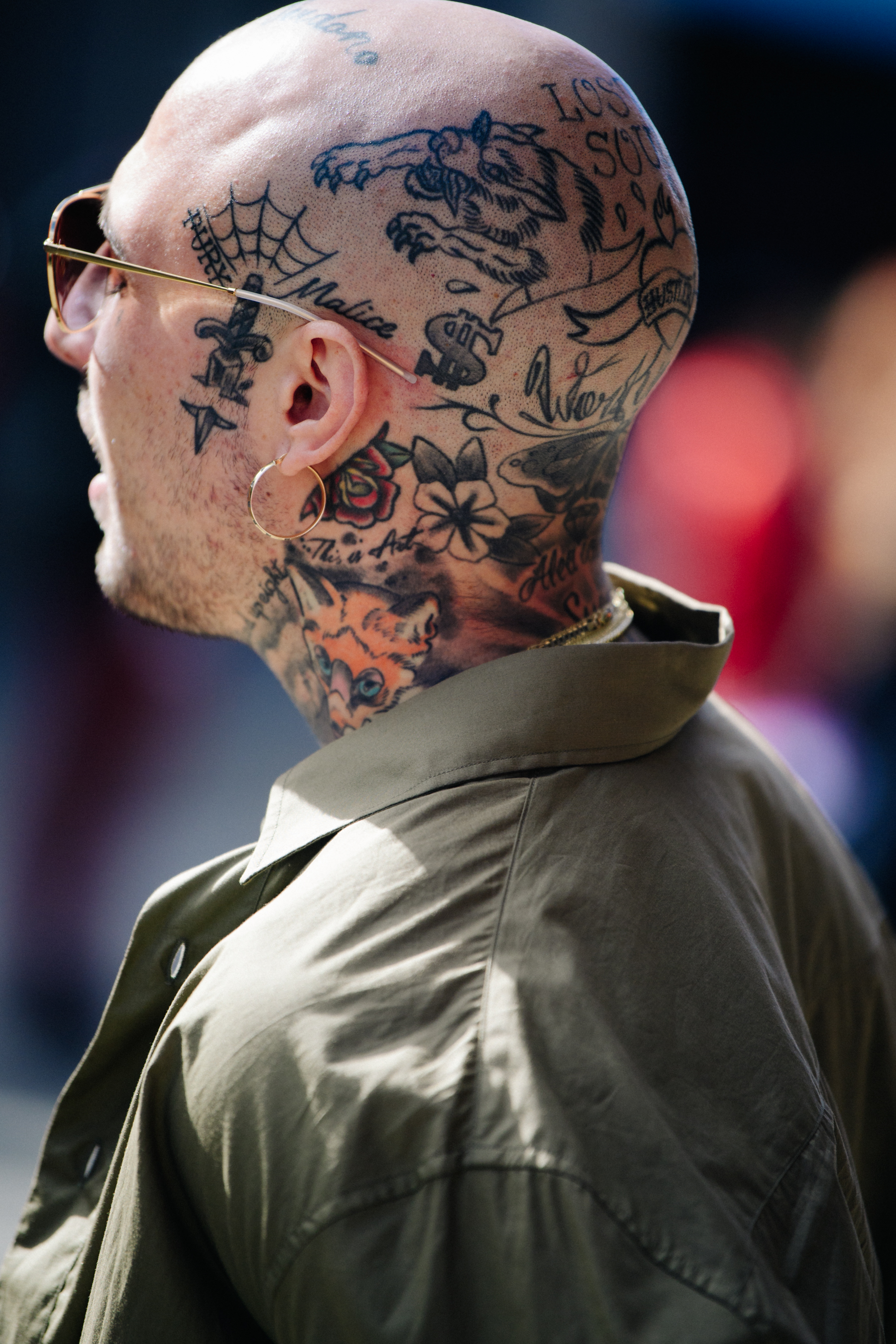 Man with head tattoos