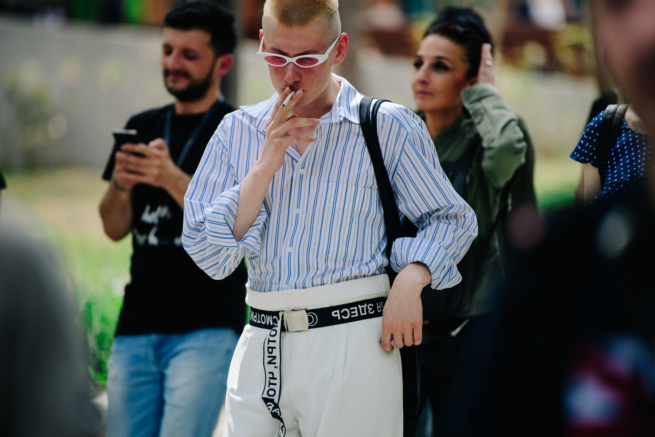 Man wearing white sunglasses