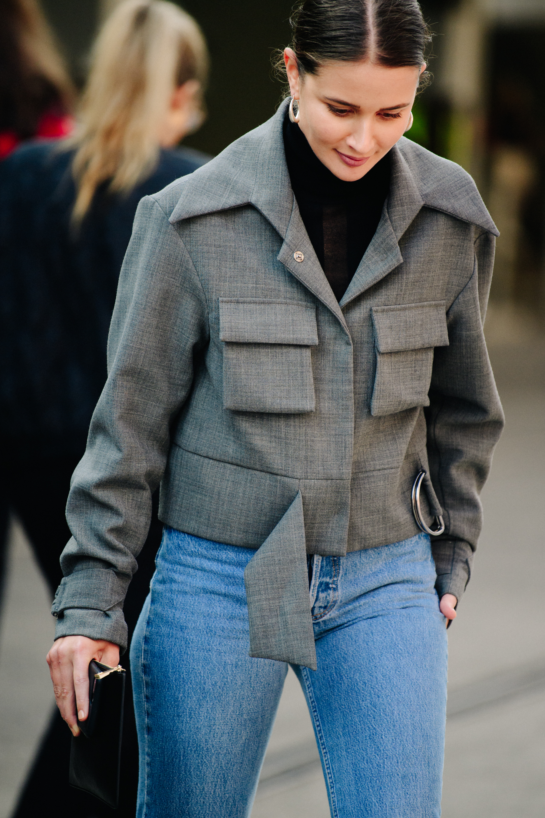 Woman wearing grey jacket