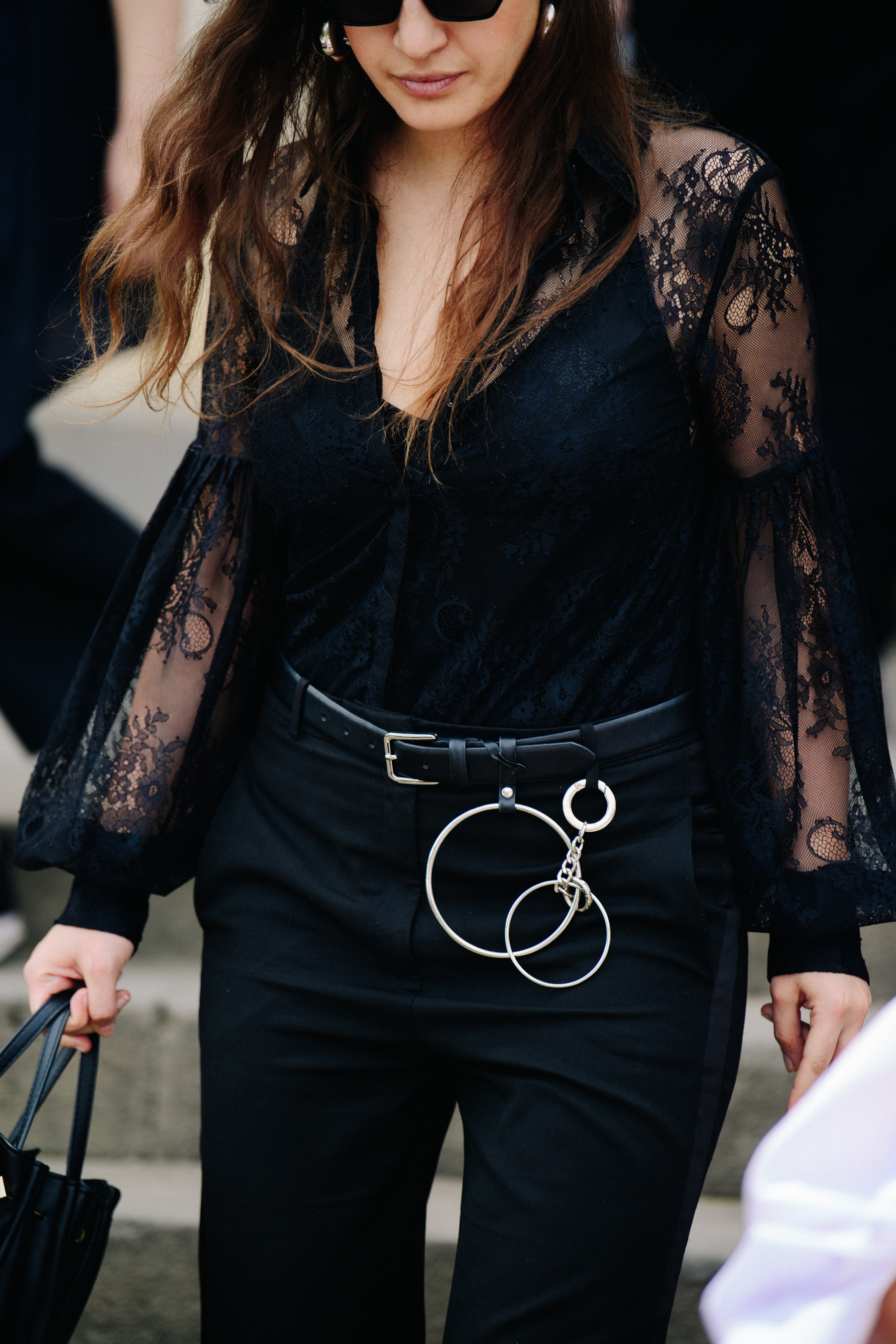 Woman wearing black lace shirt